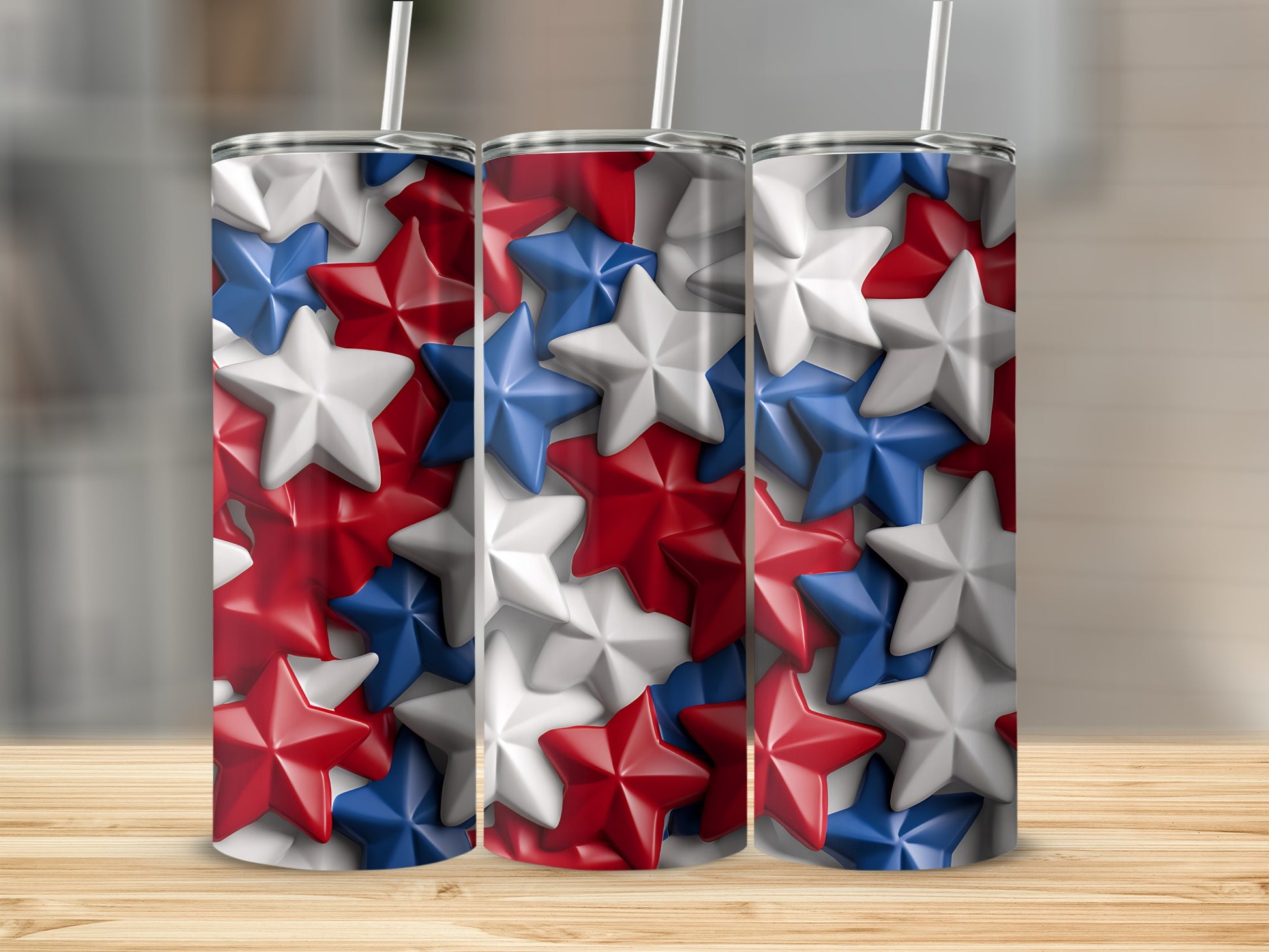 Three tumblers with a red, white, and blue star pattern and straws.