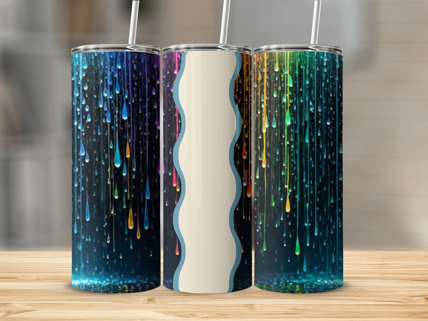 Three tumblers with colorful dripping paint designs and white wave accents.