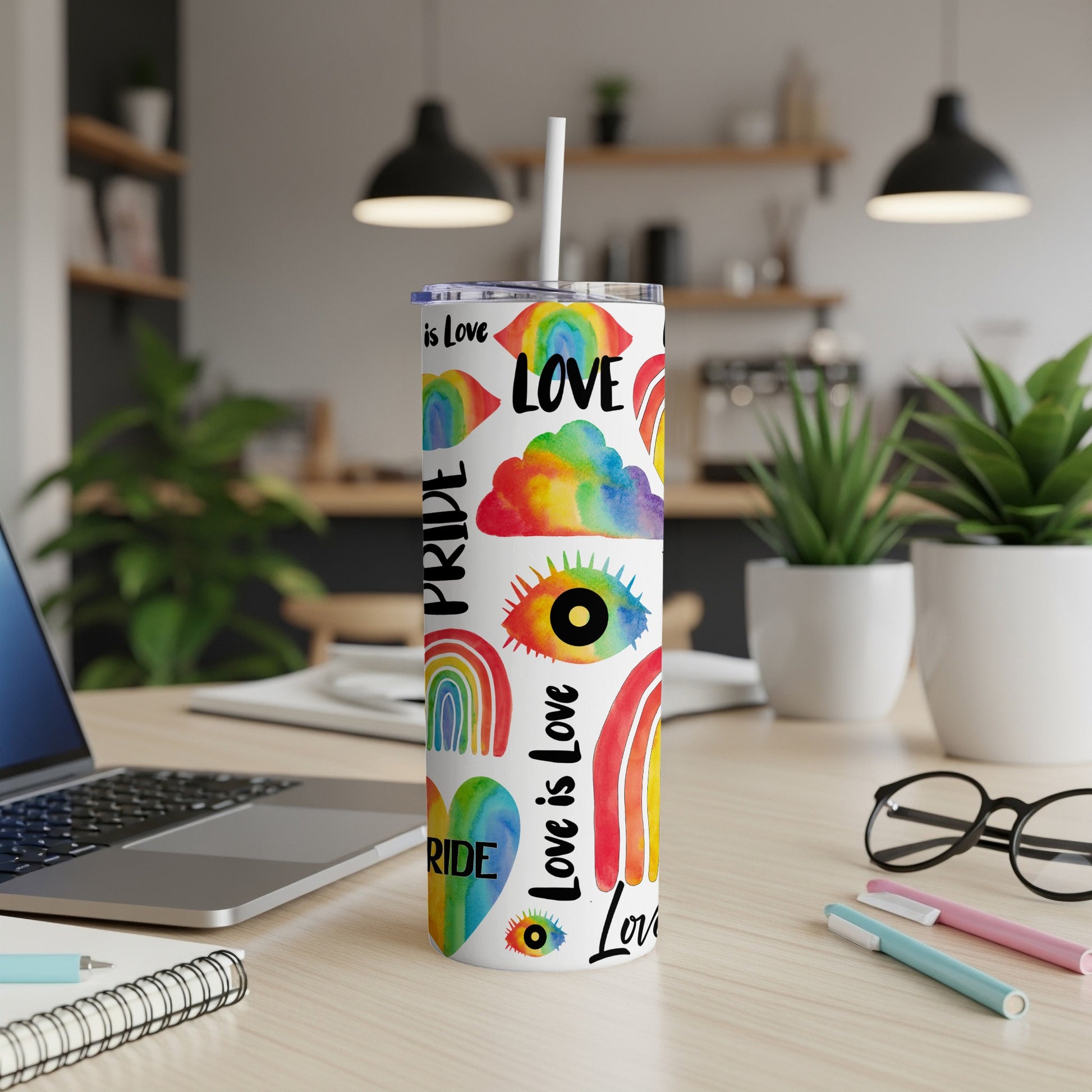 Pride rainbow tumbler with "Love is Love" text and rainbow patterns.
