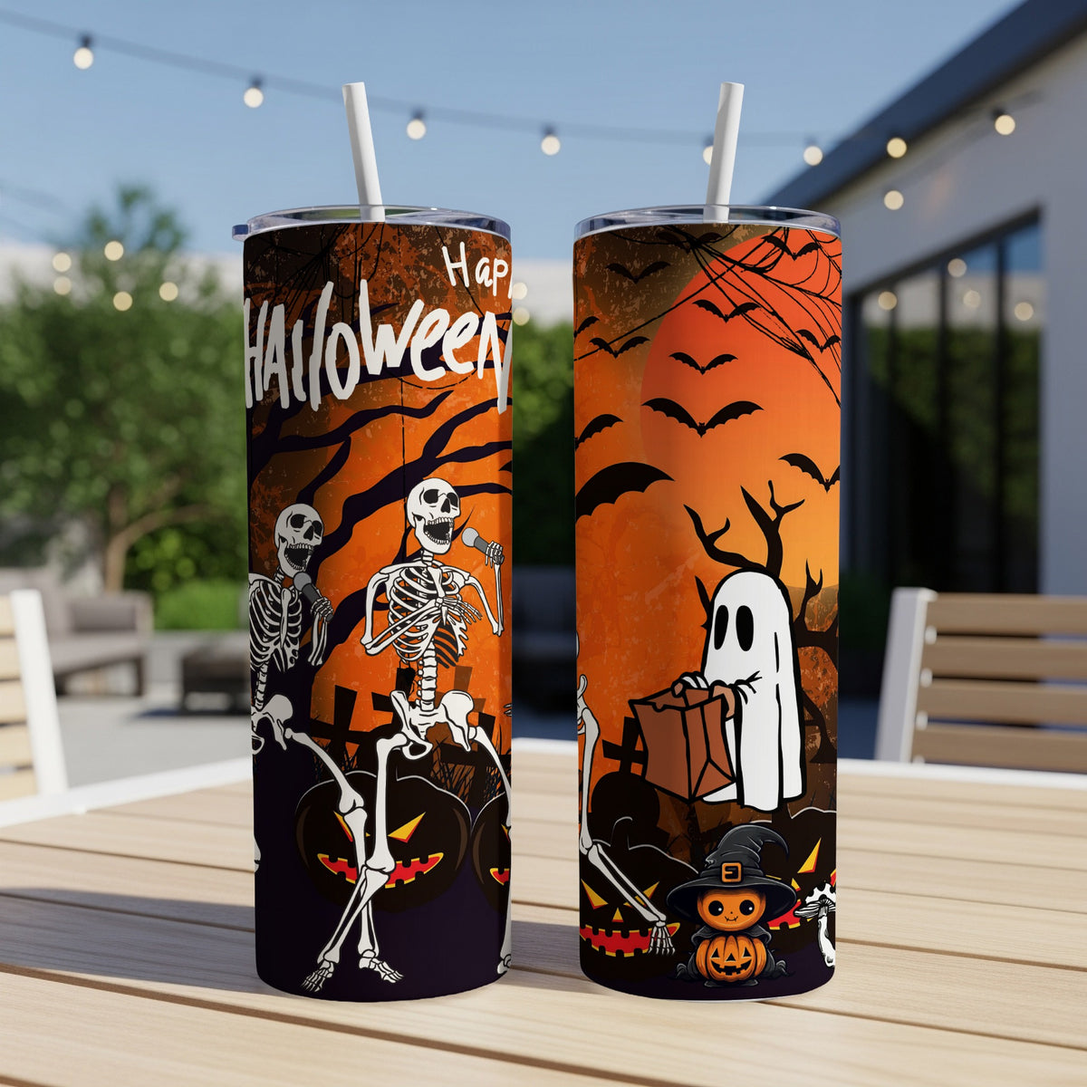 Two Halloween-themed tumblers with skeletons, ghost, and pumpkin designs.