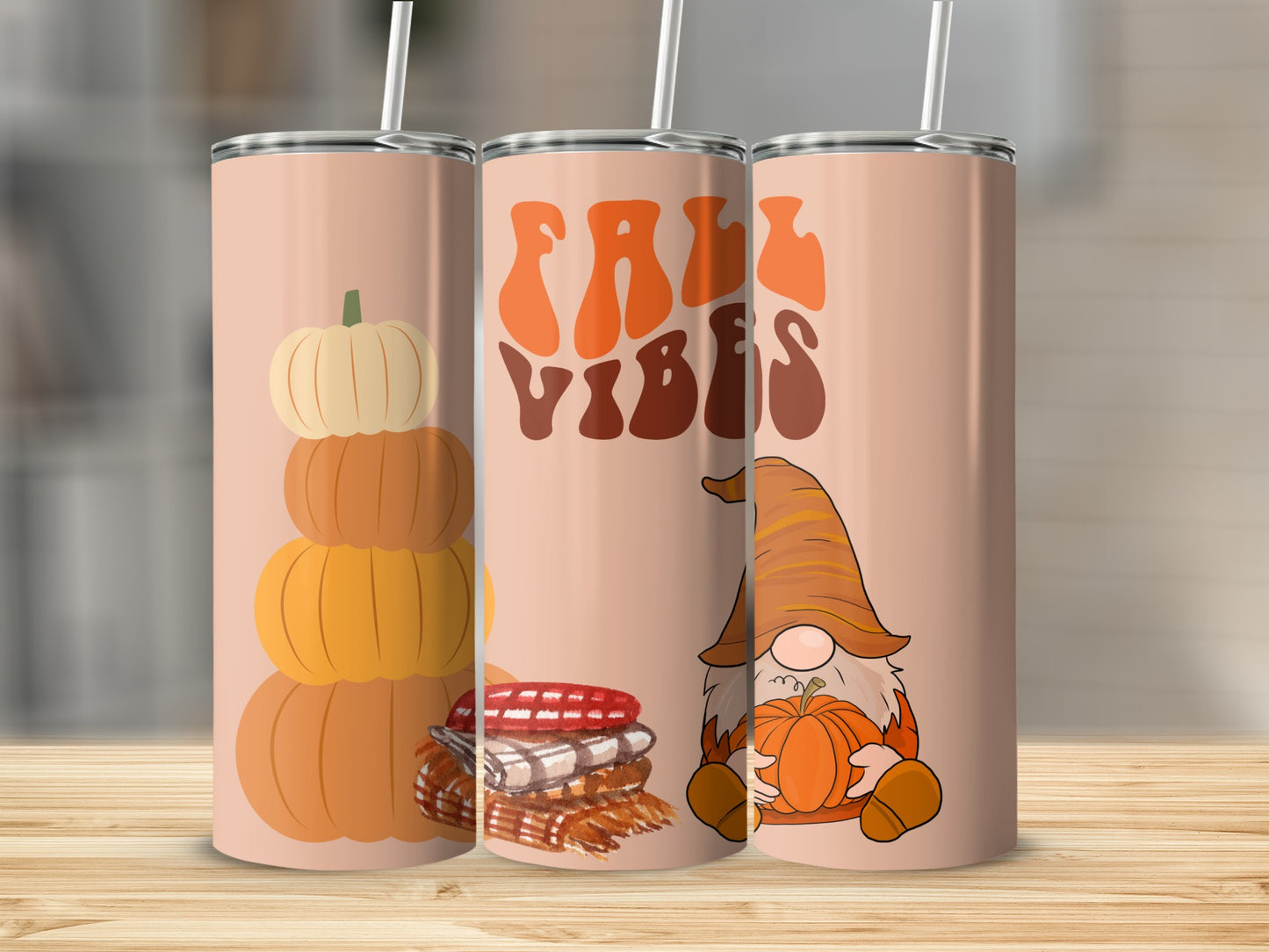 Tumbler with stacked pumpkins, plaid, and gnome holding pumpkin.