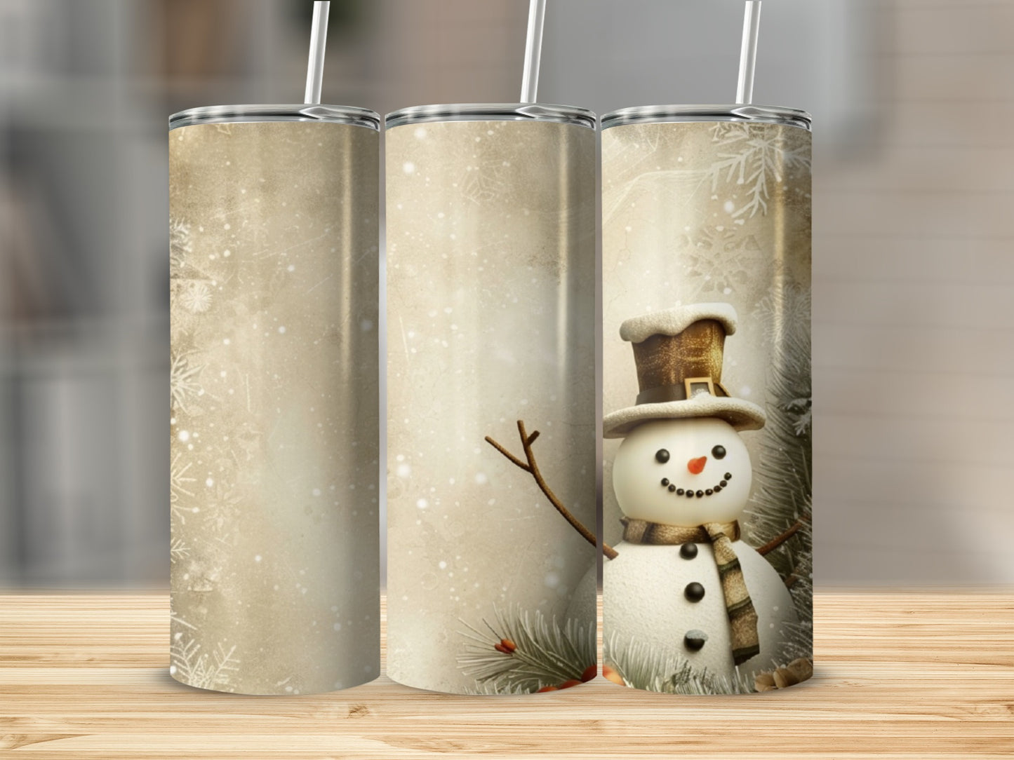 Three tumblers, one featuring a snowman with a hat and scarf.