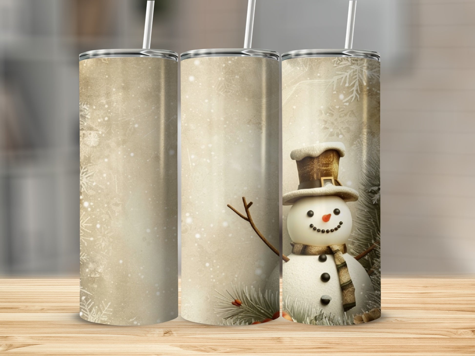 Three tumblers, one featuring a snowman with a hat and scarf.