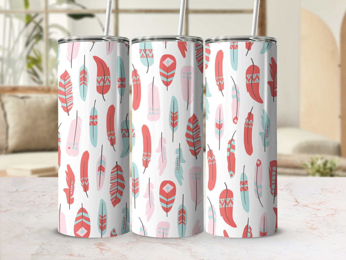 Three tumblers with a white background and a pattern of pink, coral, and teal feathers.