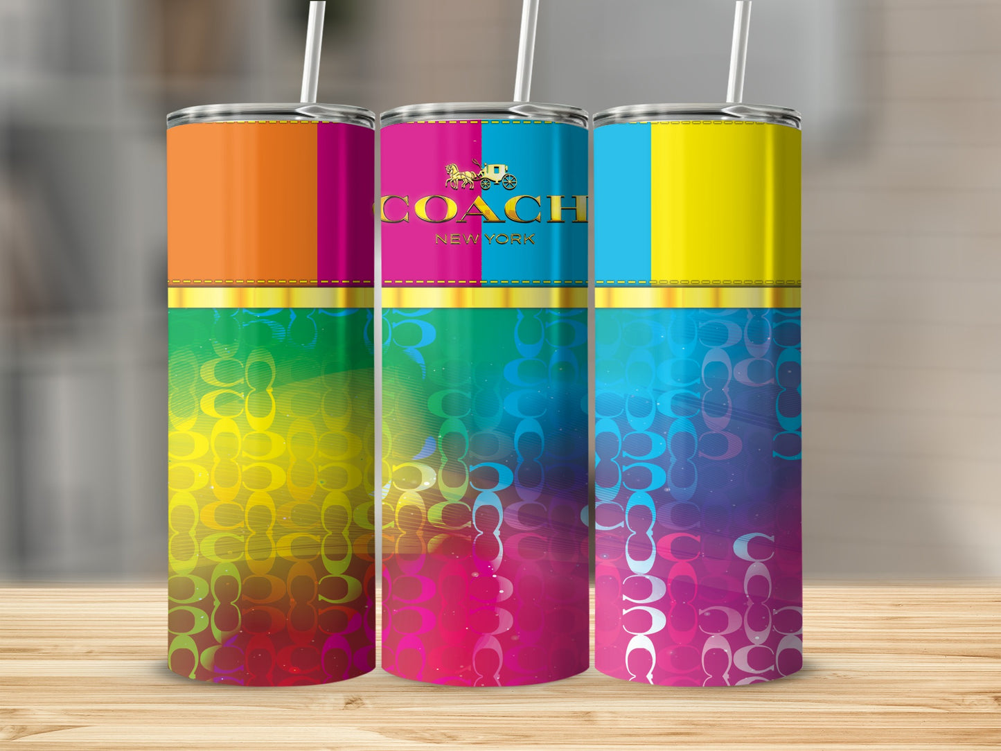 Three colorful Coach New York tumblers with repeating "C" logo pattern.