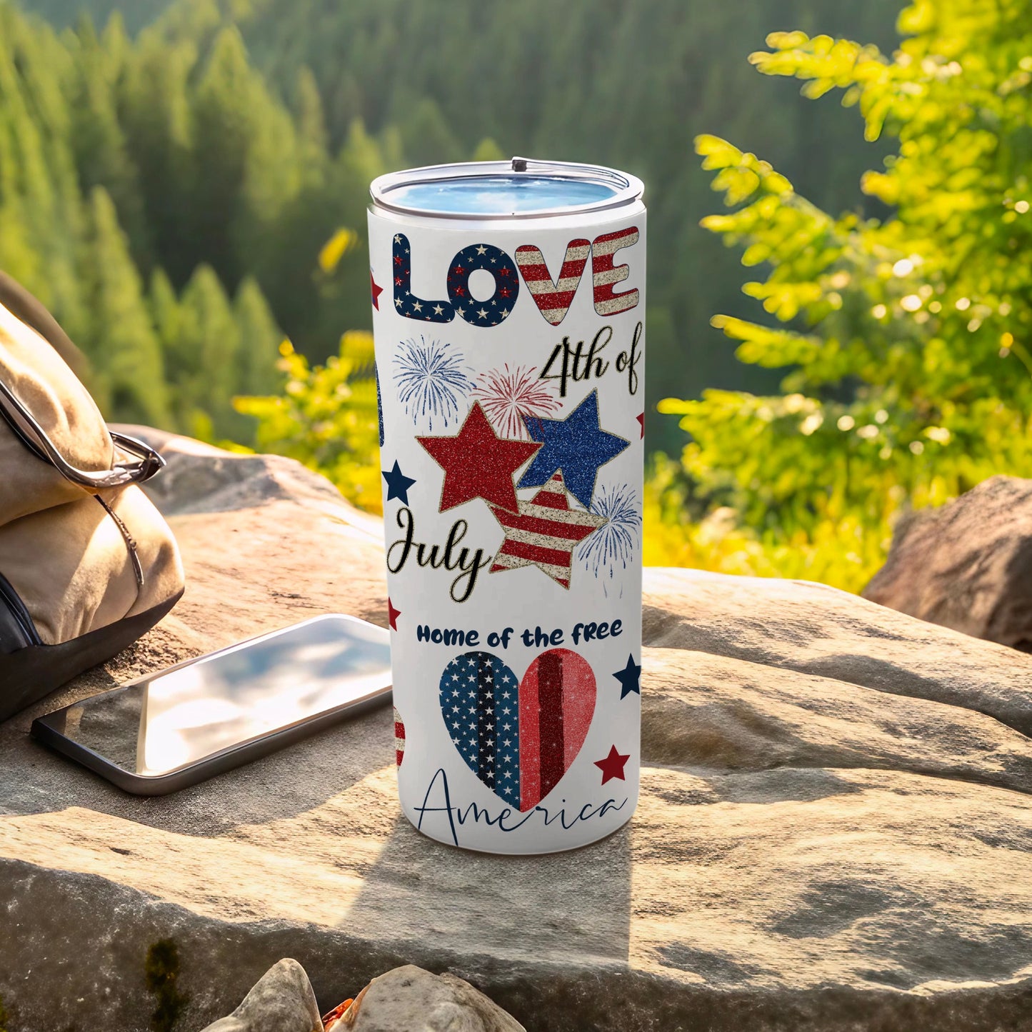 Stars and stripes tumbler with "4th of July, Home of the Free, America" text.