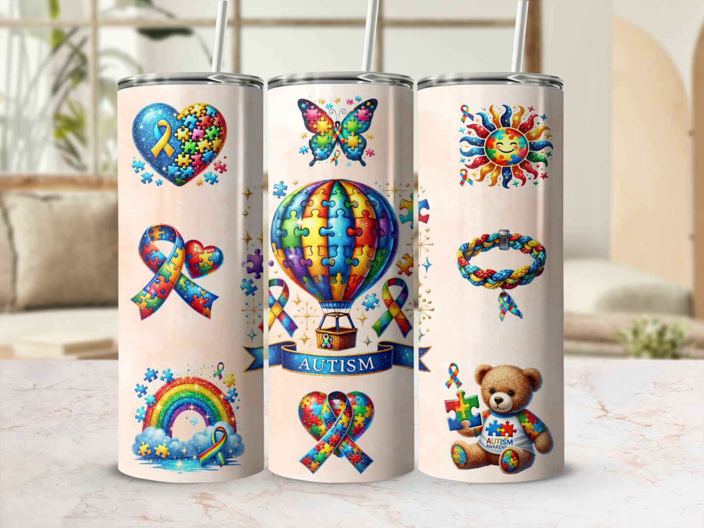 Autism awareness tumbler with puzzle pieces, butterfly, rainbow, and teddy bear.