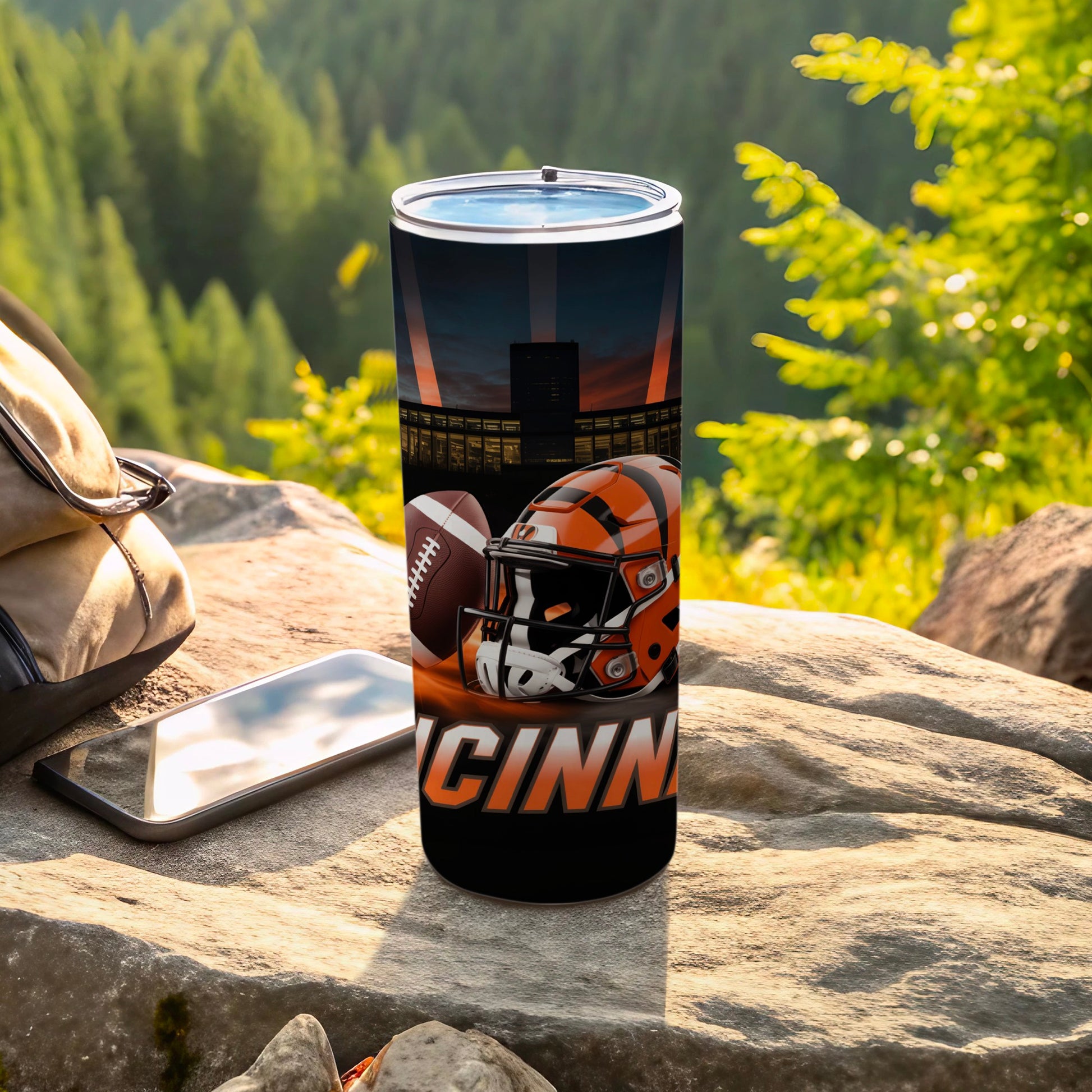 Cincinnati Bengals helmet and football graphic on a black tumbler.