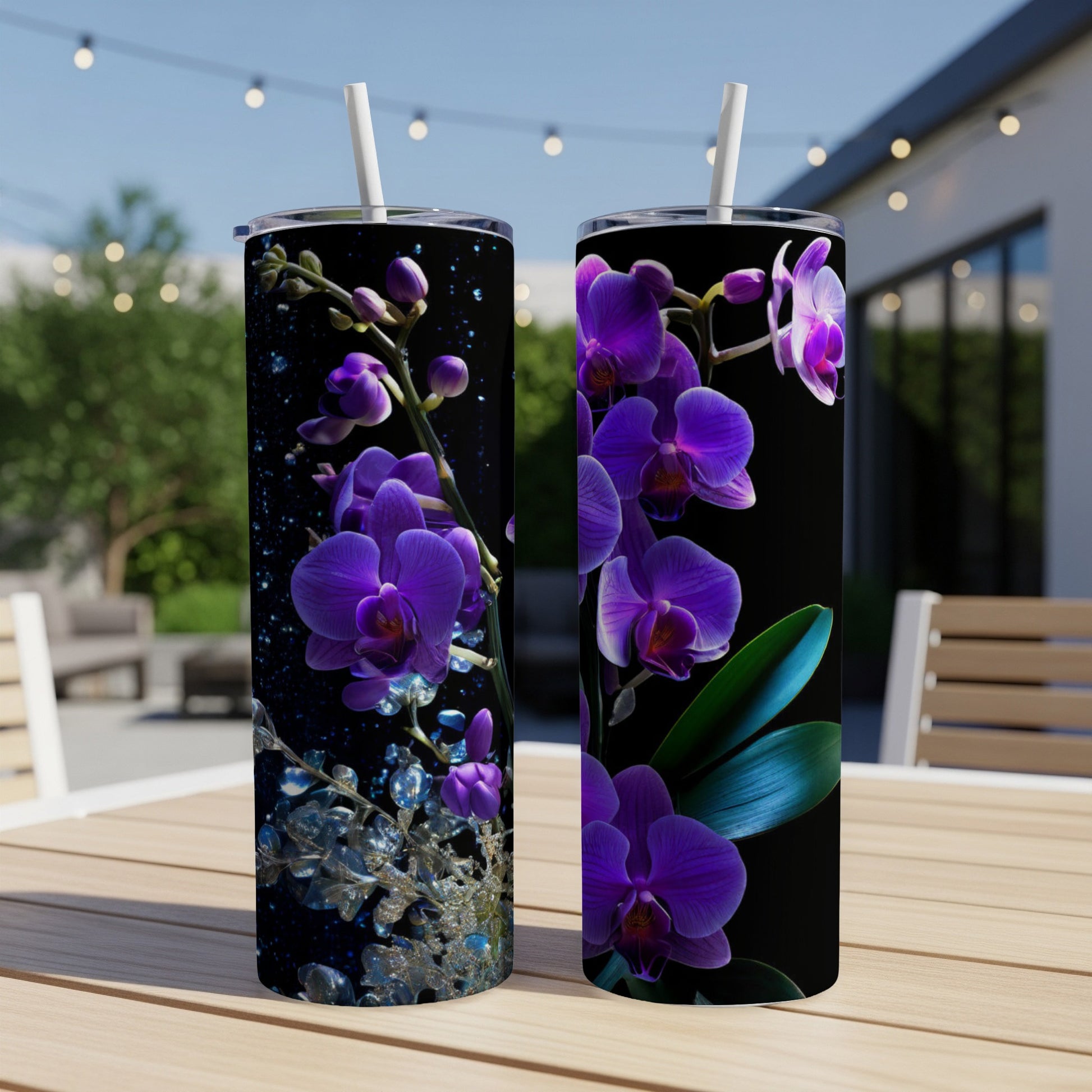 Purple orchids and water droplets on a black background on two tumblers.