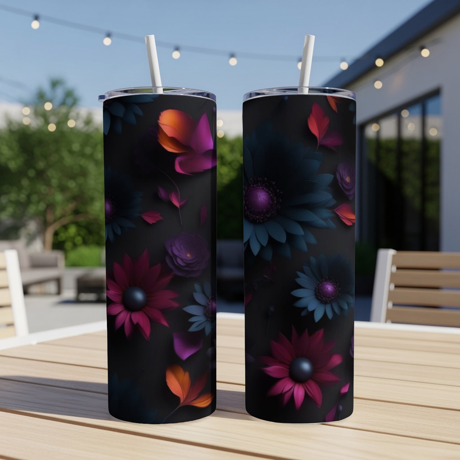 Two tumblers with dark floral designs and vibrant pink and purple petals.
