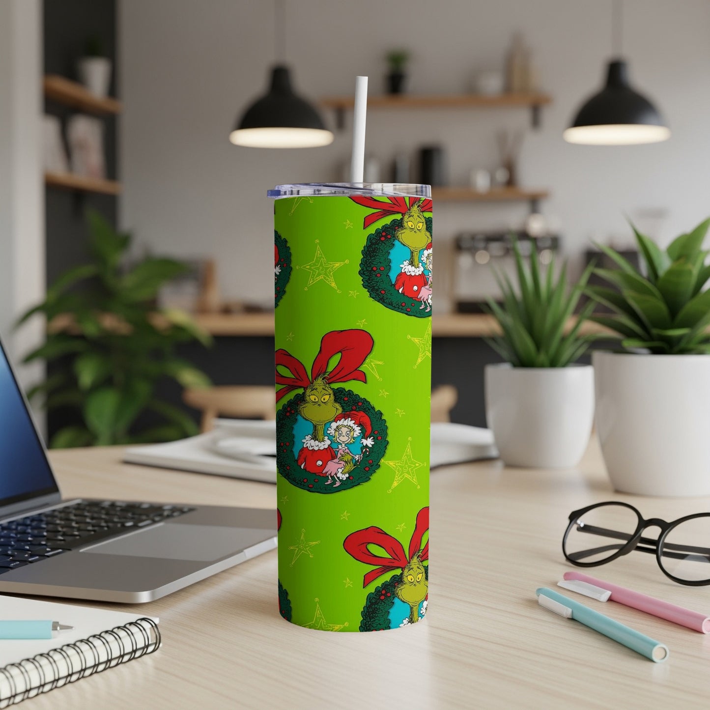 Green tumbler with Grinch and Max illustrations, red bows, and stars.