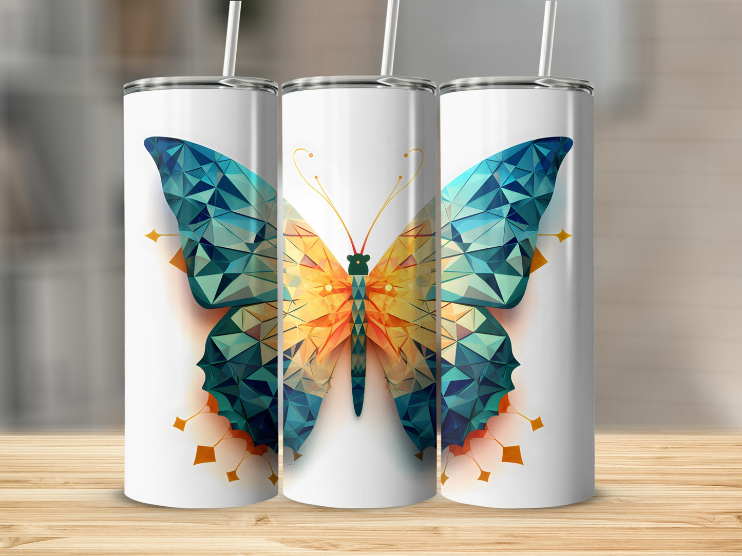 Three tumblers with a geometric butterfly design.