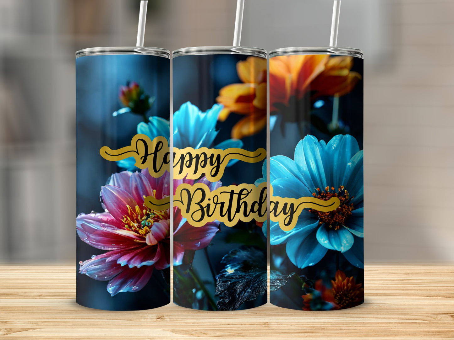 Three tumblers with happy birthday text and colorful floral designs.