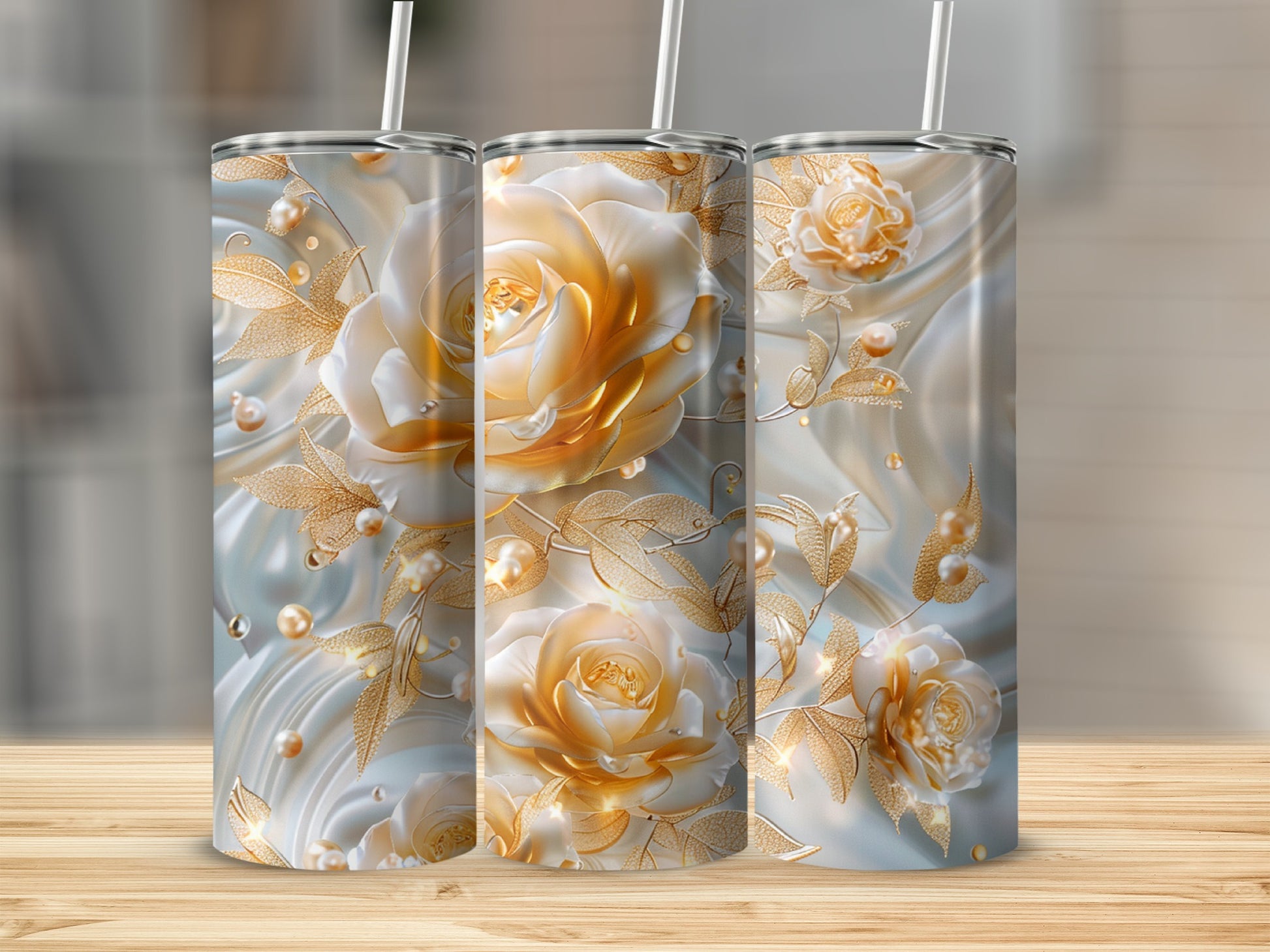 Three tumblers with pearlescent white and gold roses and swirling leaves.