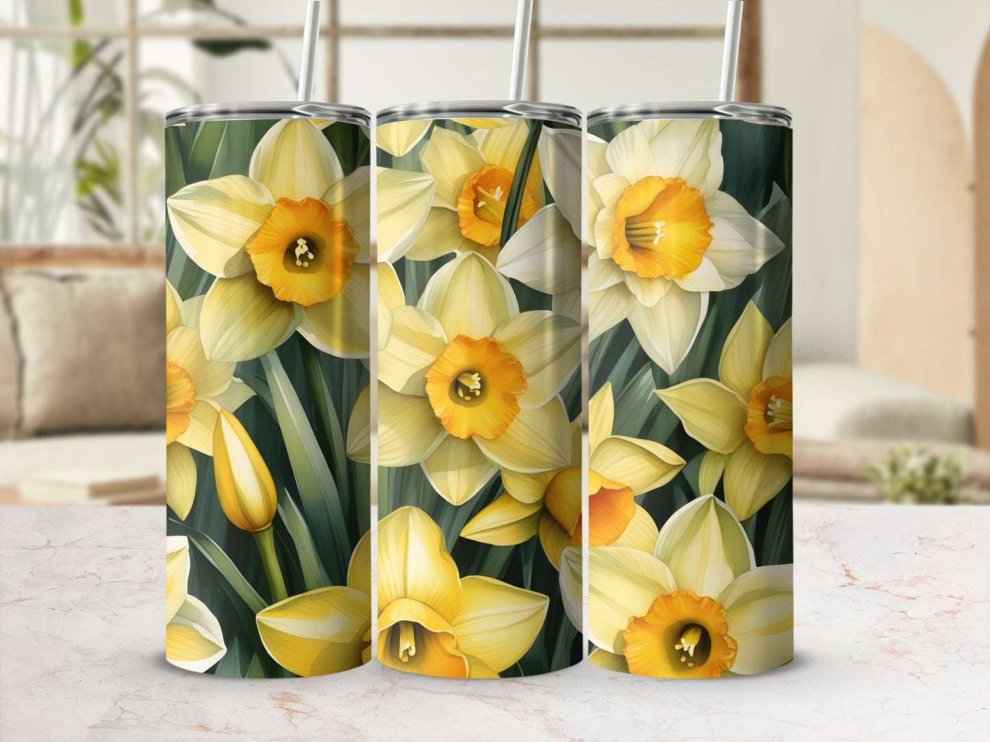 Three tumblers with a repeating pattern of yellow and white daffodils.