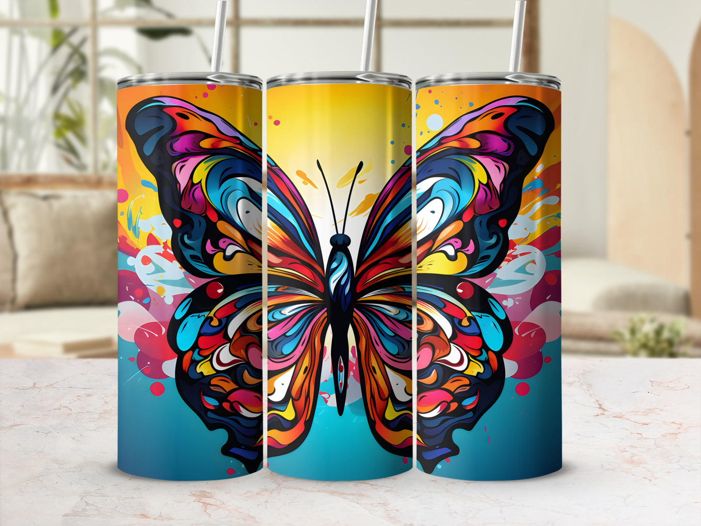 Colorful butterfly design on three tumblers with straws.