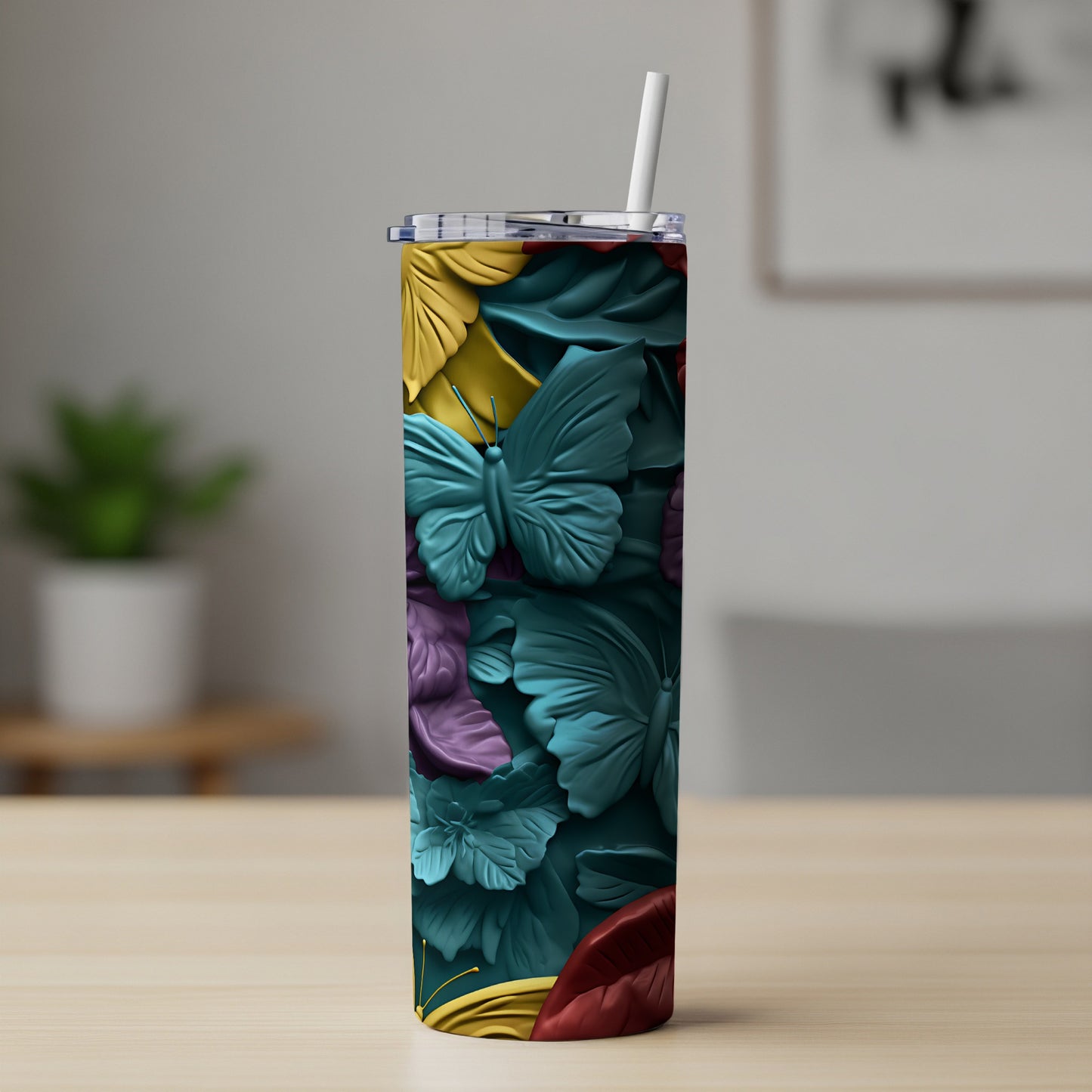 Tall tumbler with embossed butterflies and floral pattern.