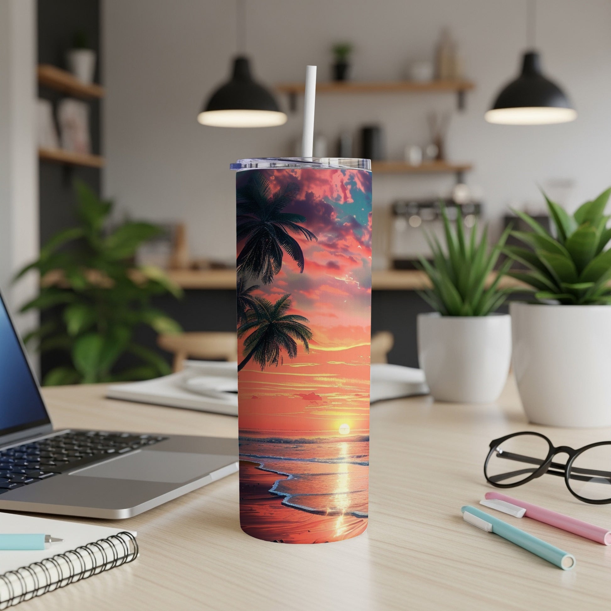 Beach sunset with palm trees on a skinny tumbler with a straw.