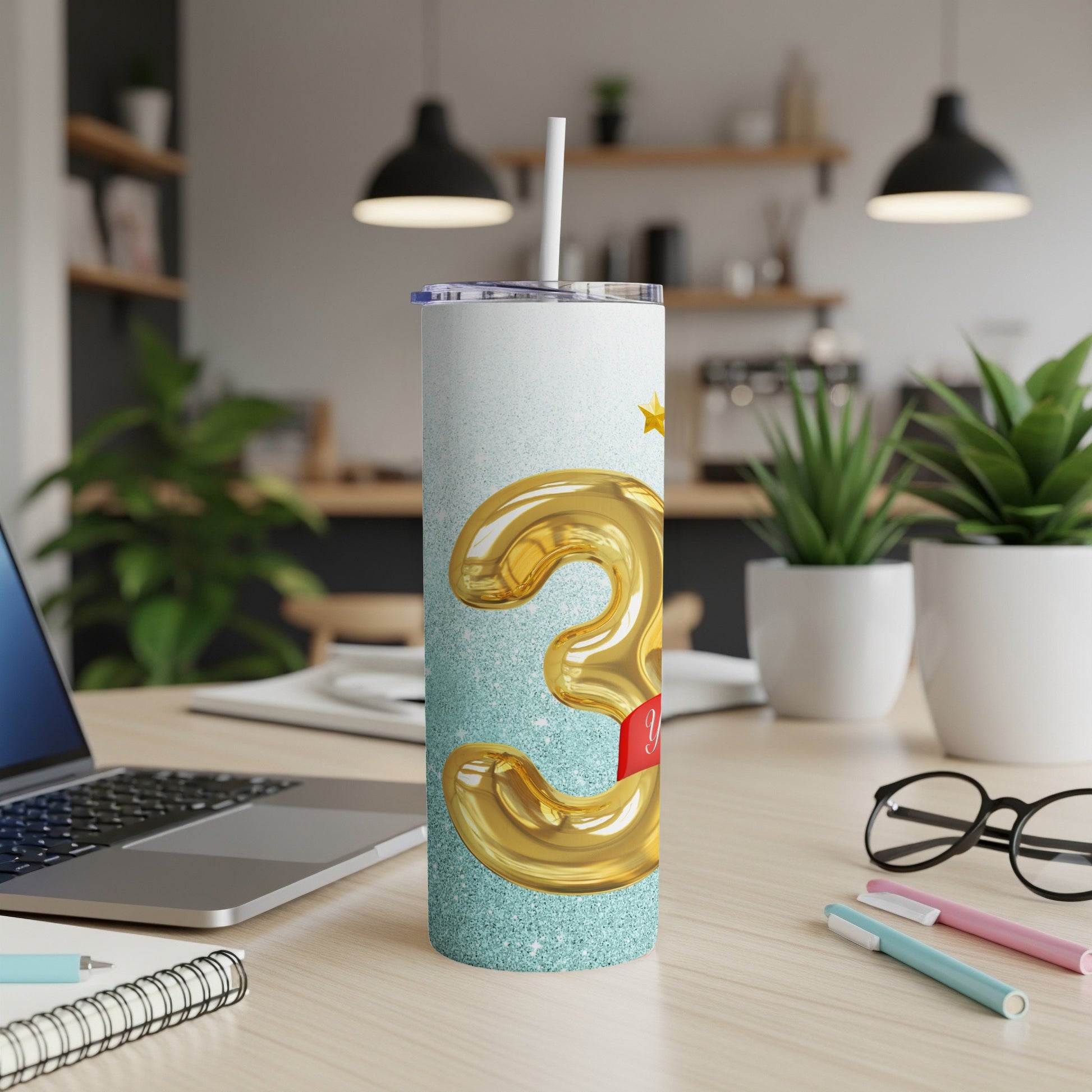 Gold "3" balloon tumbler with glitter and red ribbon.
