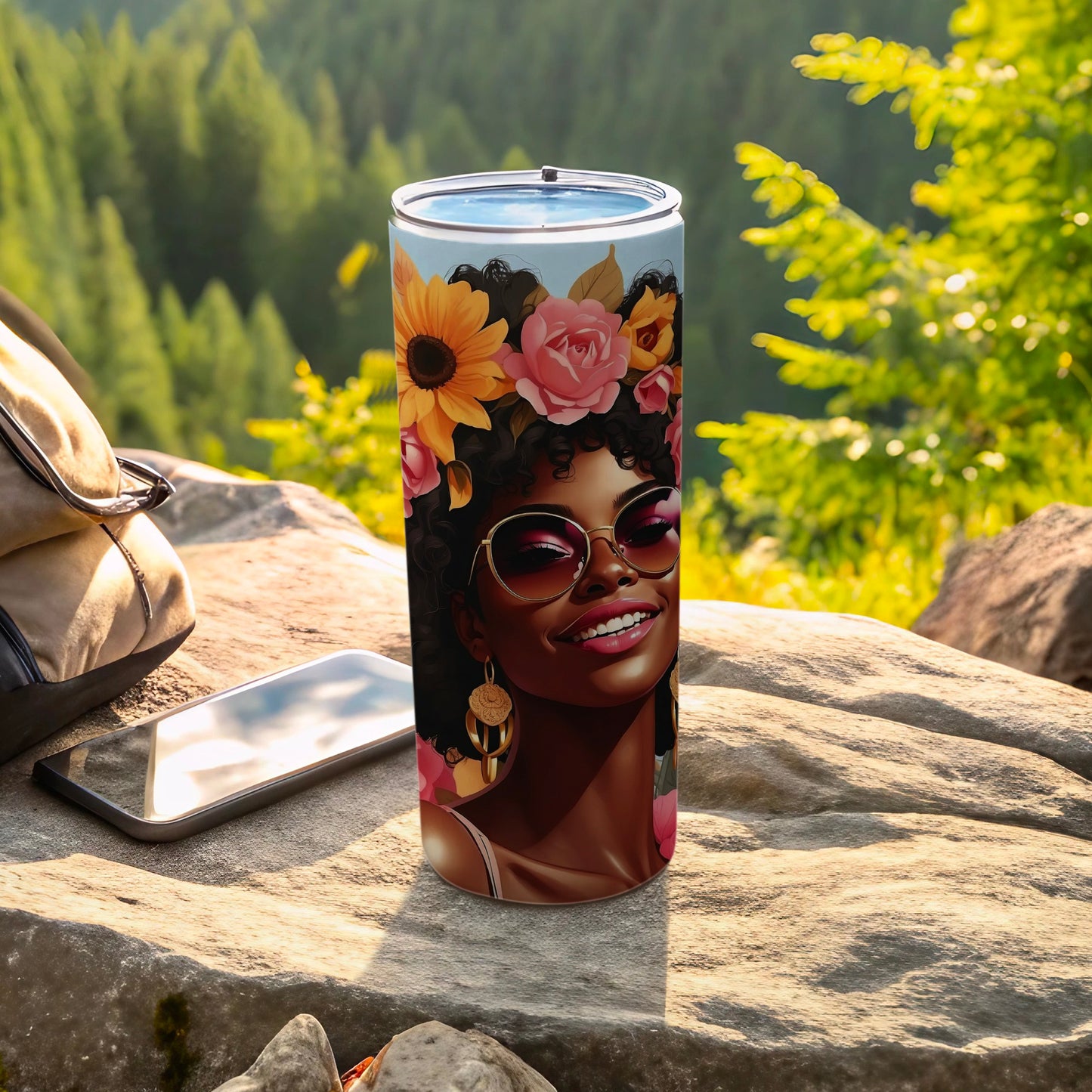 Tumbler with floral design featuring a smiling woman with sunglasses and flowers in her hair.