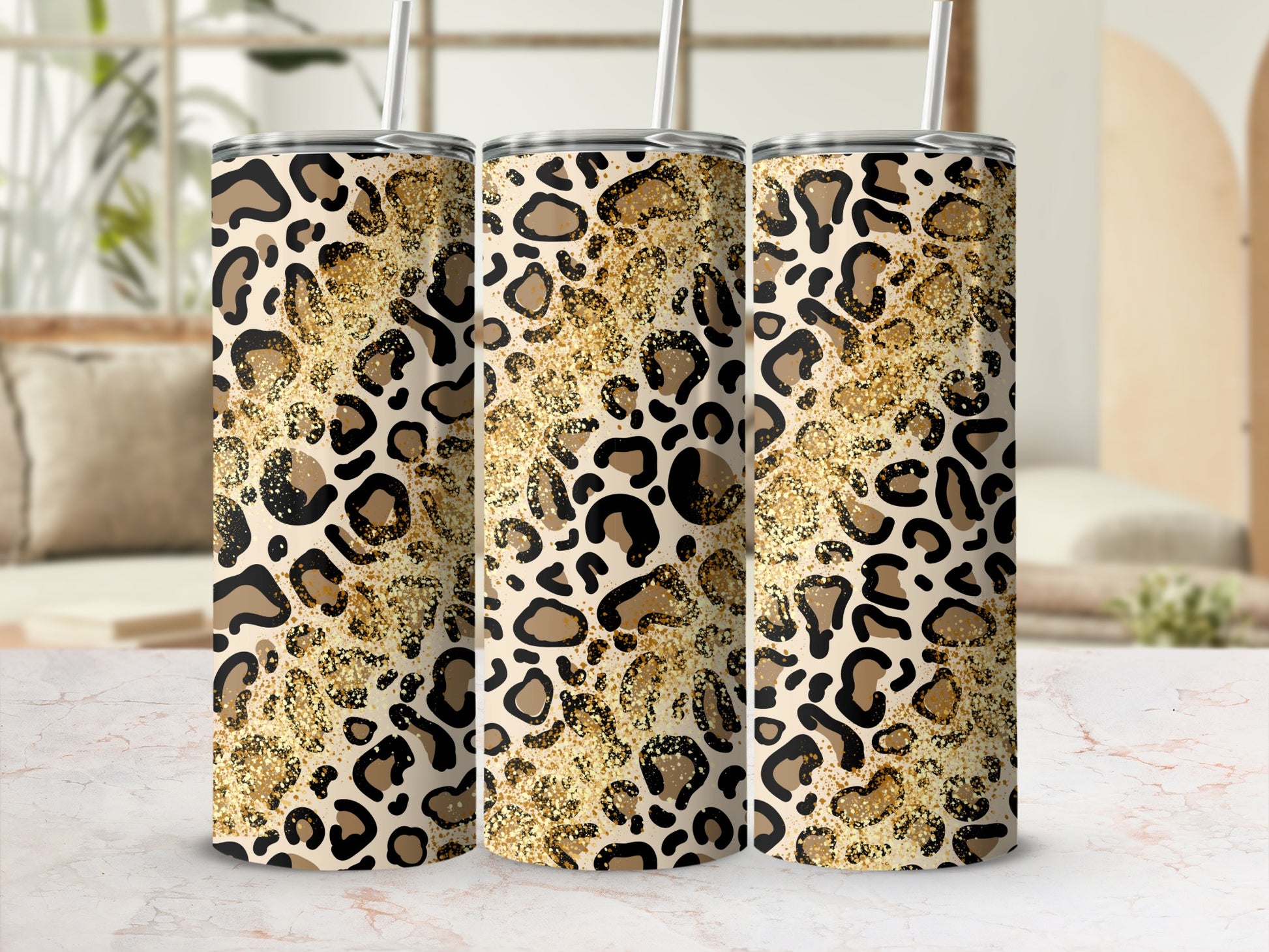 Three tumblers with leopard print and gold glitter design.