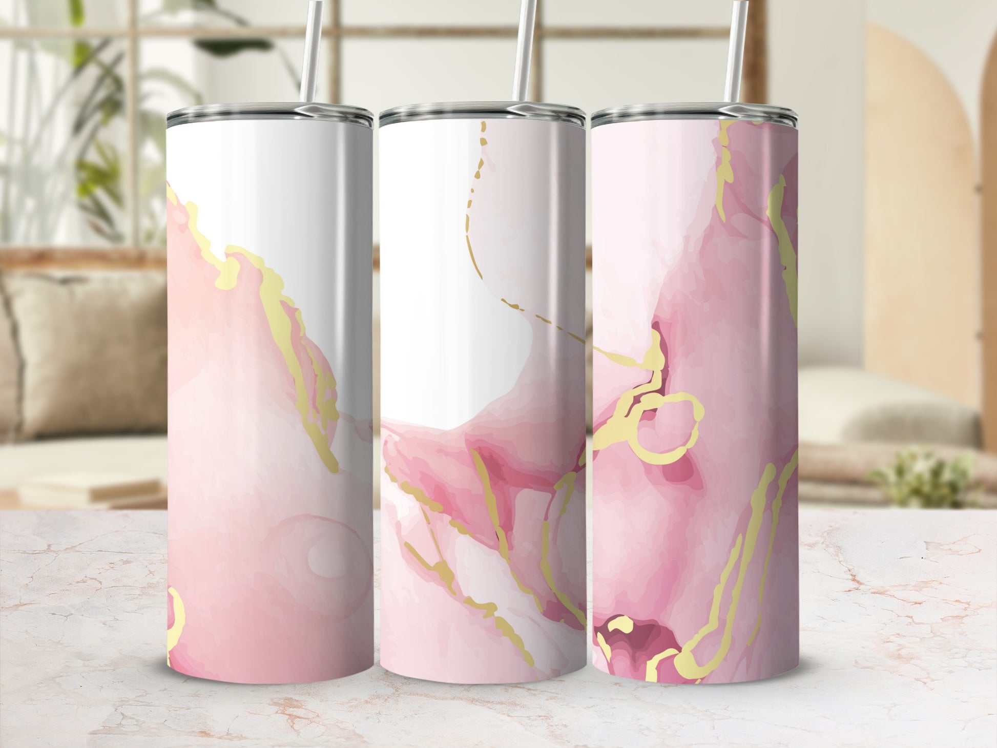 Pink and gold abstract marble design on three tumblers.