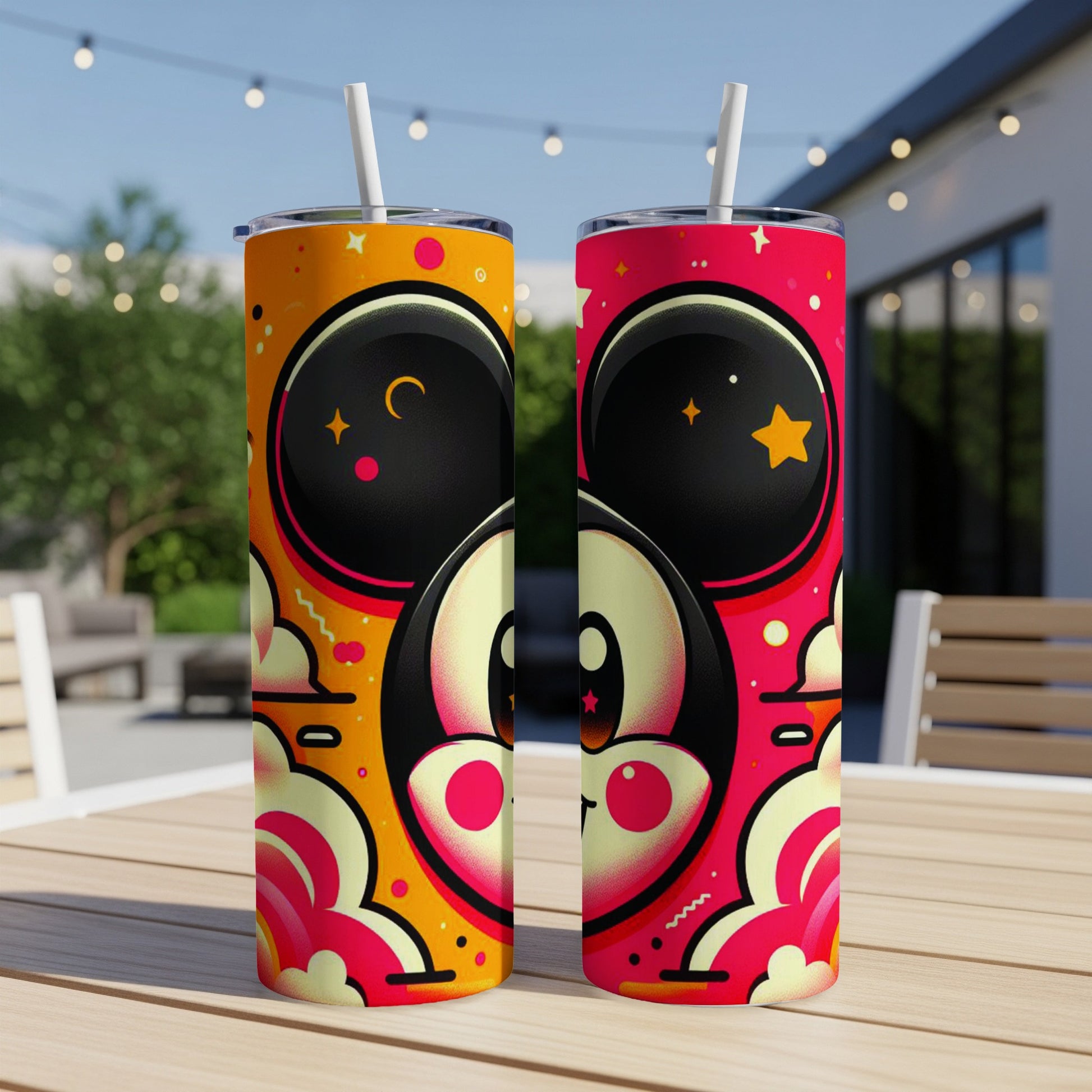 Two cartoon tumblers with colorful, playful designs featuring characters with large eyes.