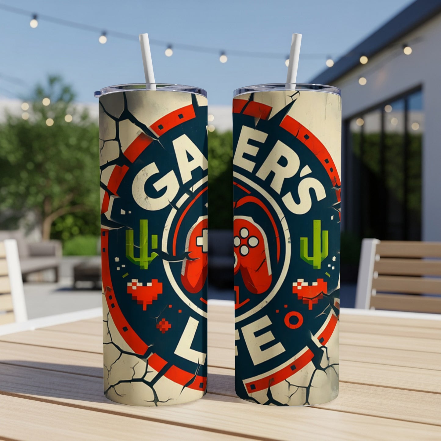 "Gamer's Life" logo with controller, cacti, and pixelated elements on two tumblers.