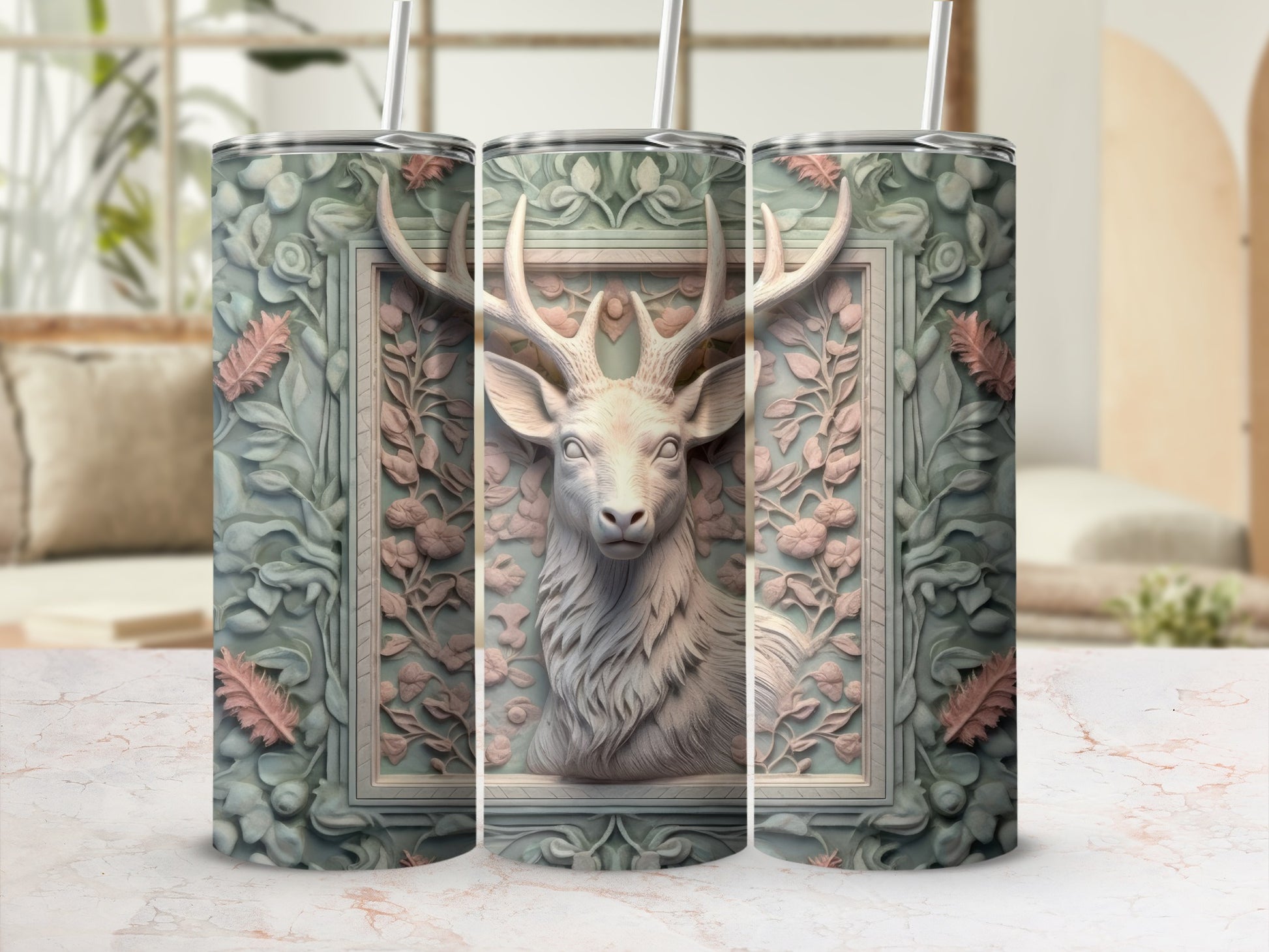 Deer head in ornate frame with floral accents on a patterned tumbler.