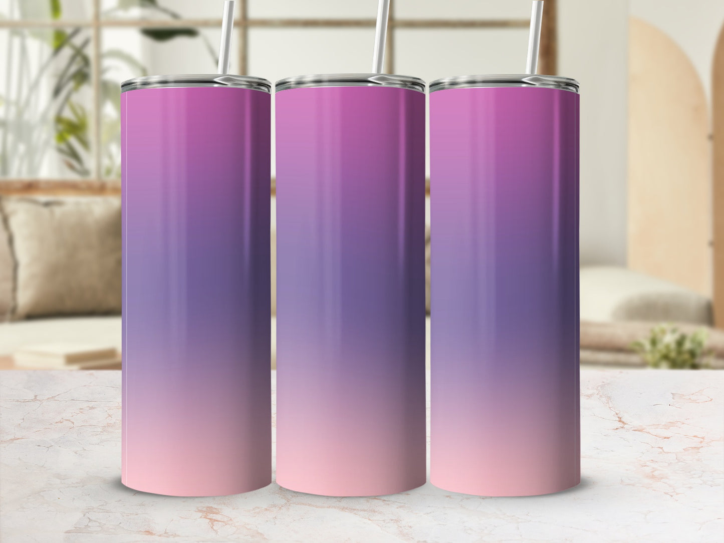 Three gradient tumblers with purple and pink ombre design, standing on a marble surface.