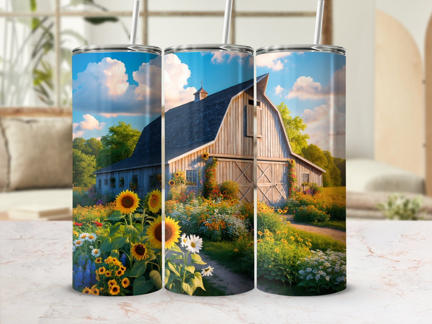 Three tumblers decorated with a barn and sunflowers in a field.
