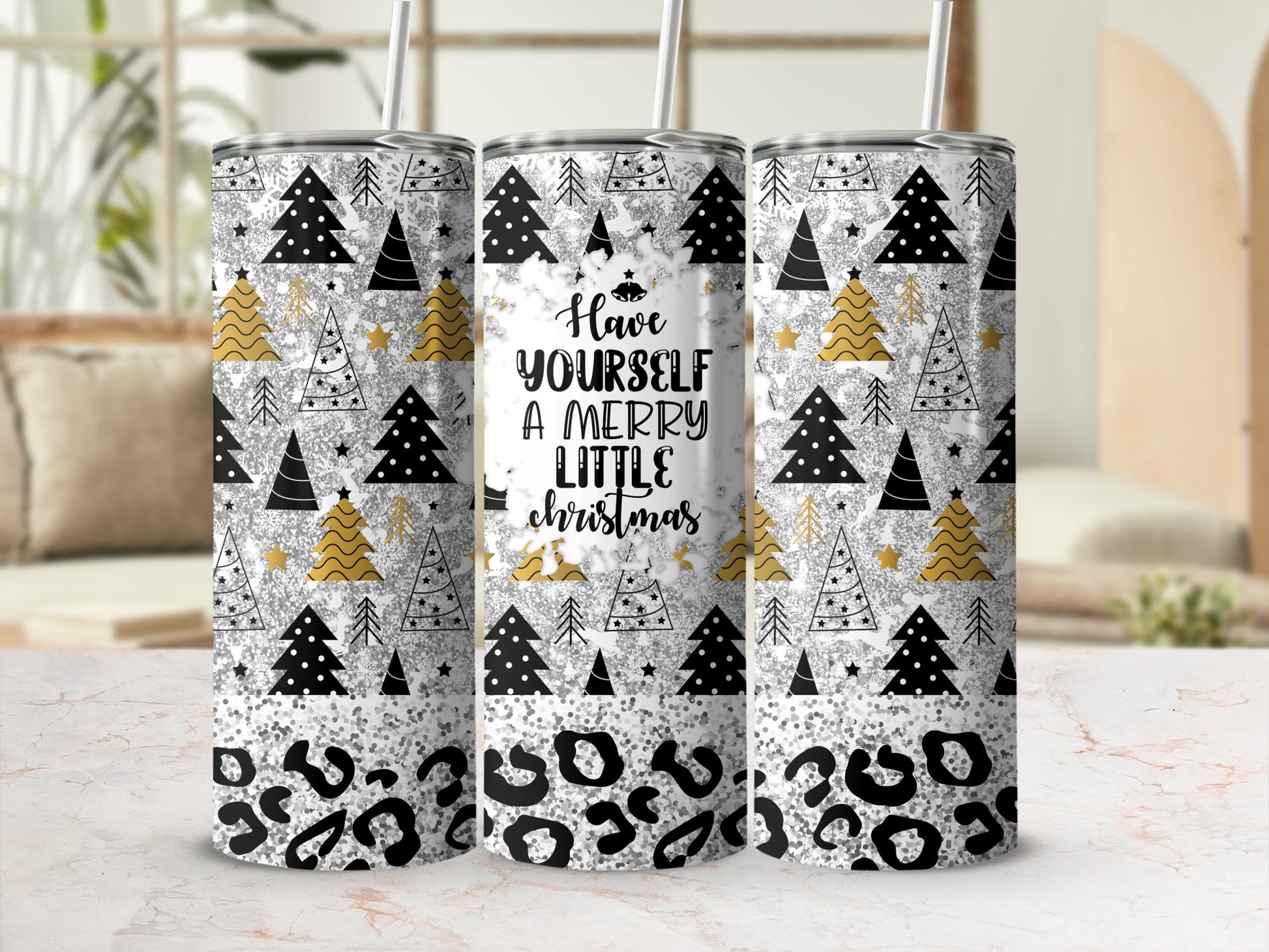 White tumbler with "Have Yourself A Merry Little Christmas" text and festive pattern.