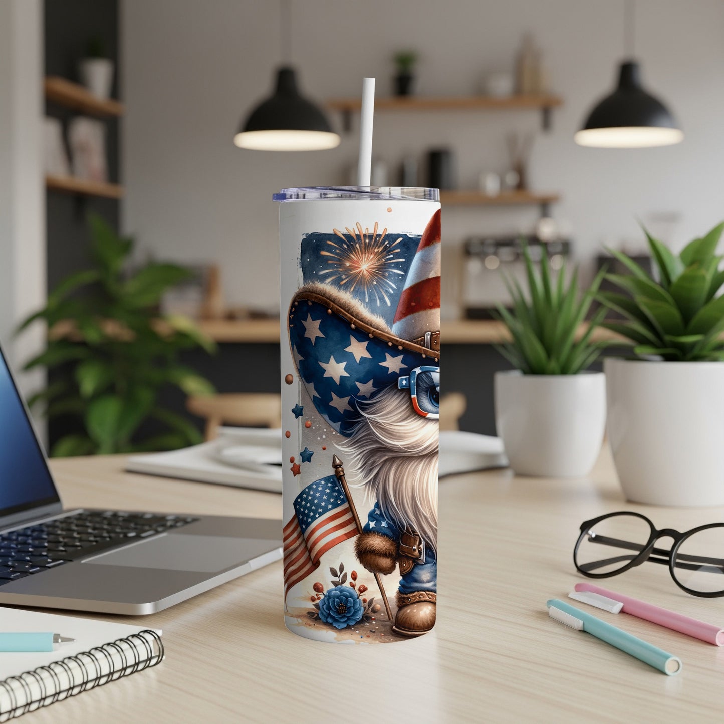 Gnome wearing patriotic hat and stars, holding US flag, on a tumbler.