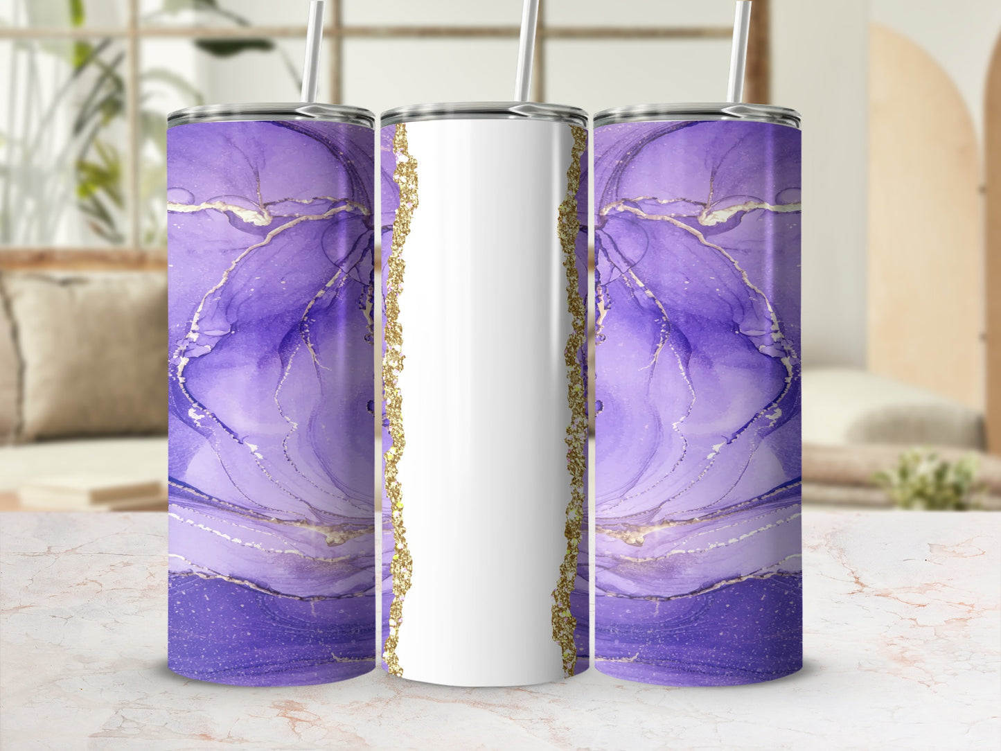 Purple abstract marble design tumbler with gold accents, on a marble surface.