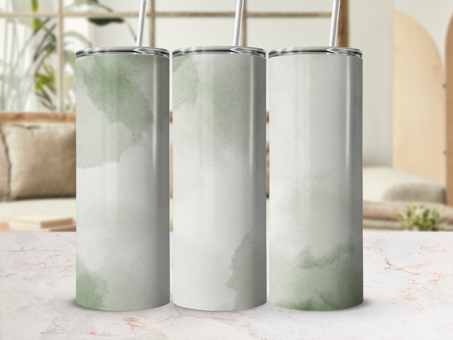 Three tall tumblers with light green watercolor paint splatters.