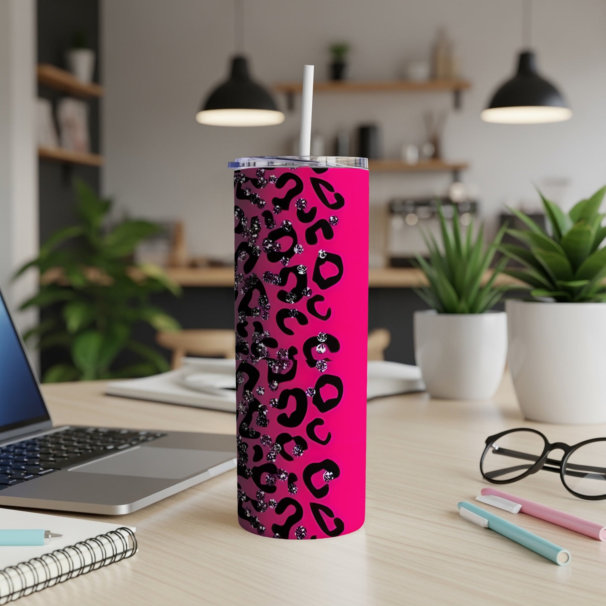 Pink tumbler with black leopard print and glitter accents.
