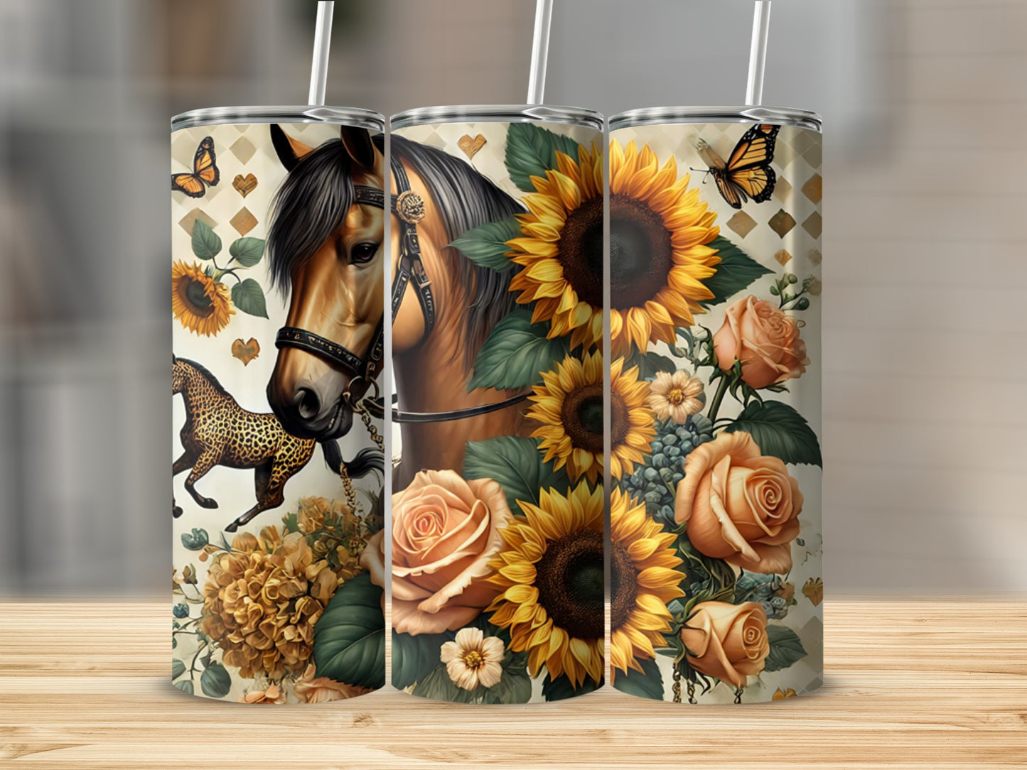Three tumblers decorated with sunflowers, roses, butterflies, and a horse portrait.
