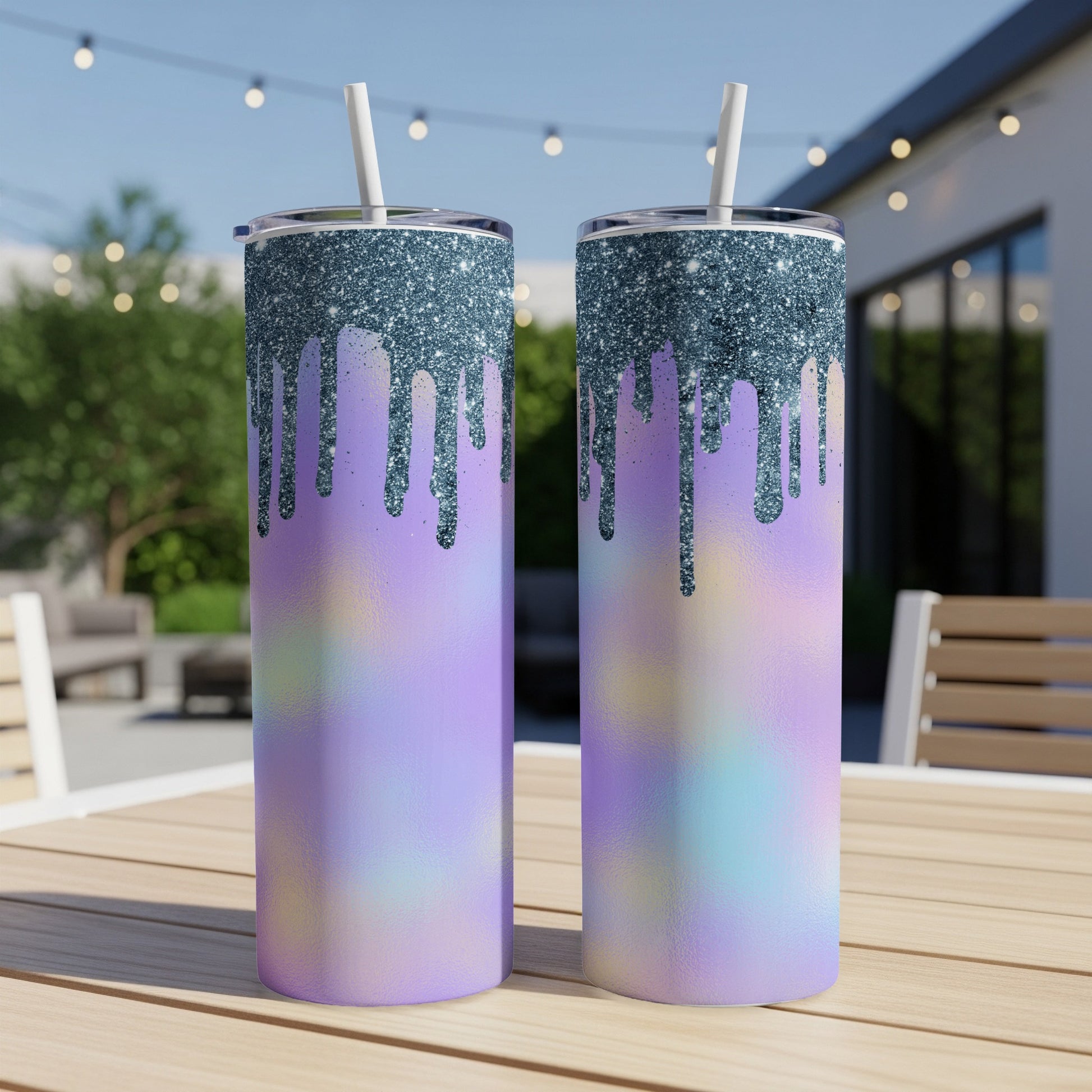 Two iridescent tumblers with glitter drip effect and white straws.