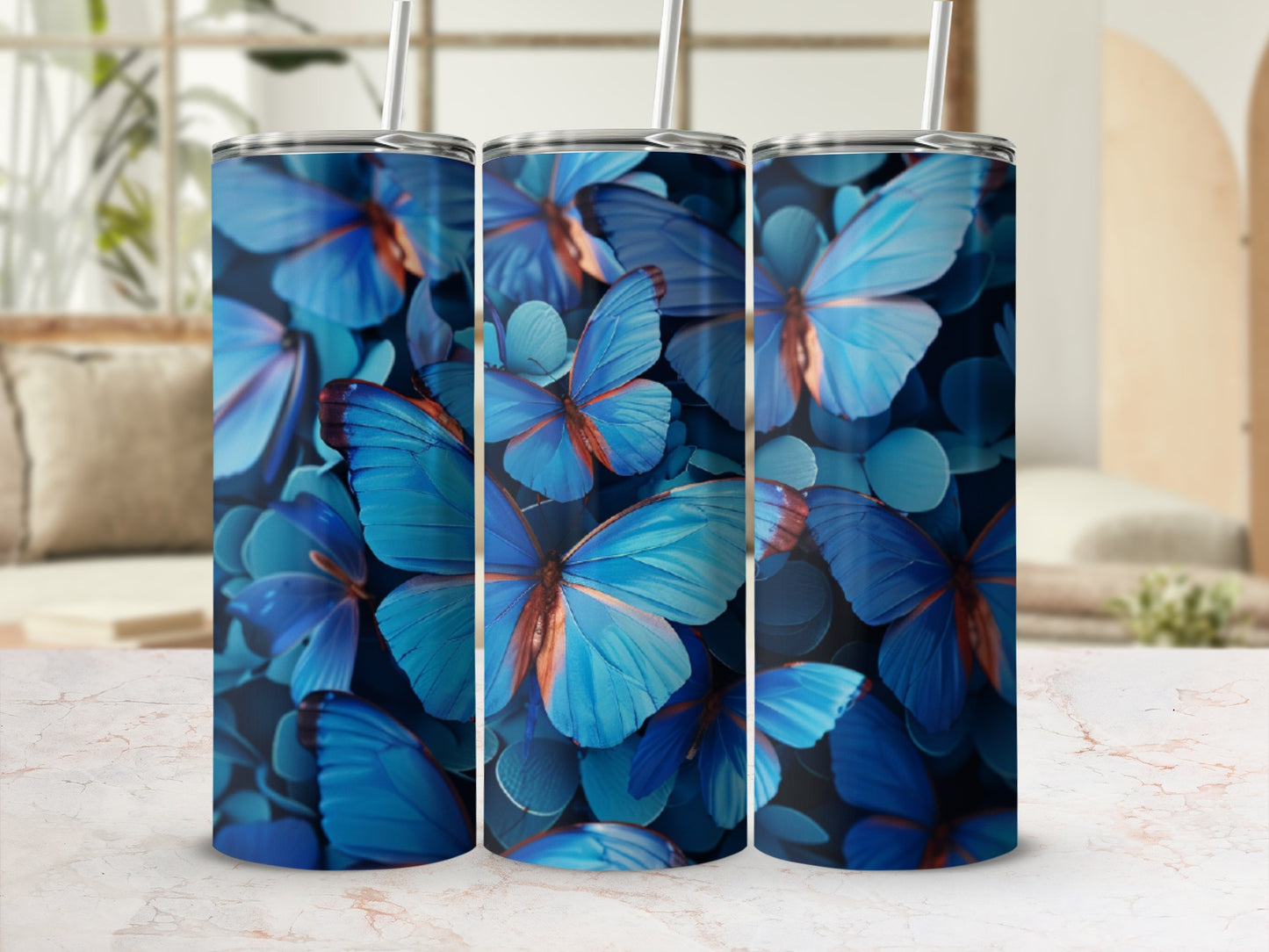 Three tumblers with blue butterflies and leaves pattern.