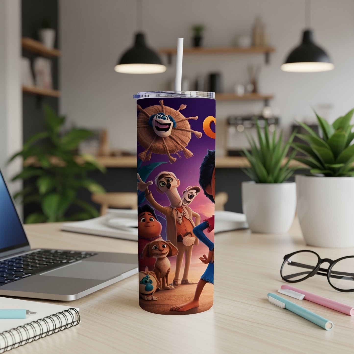 Cartoon characters on a skinny tumbler mockup on a desk.