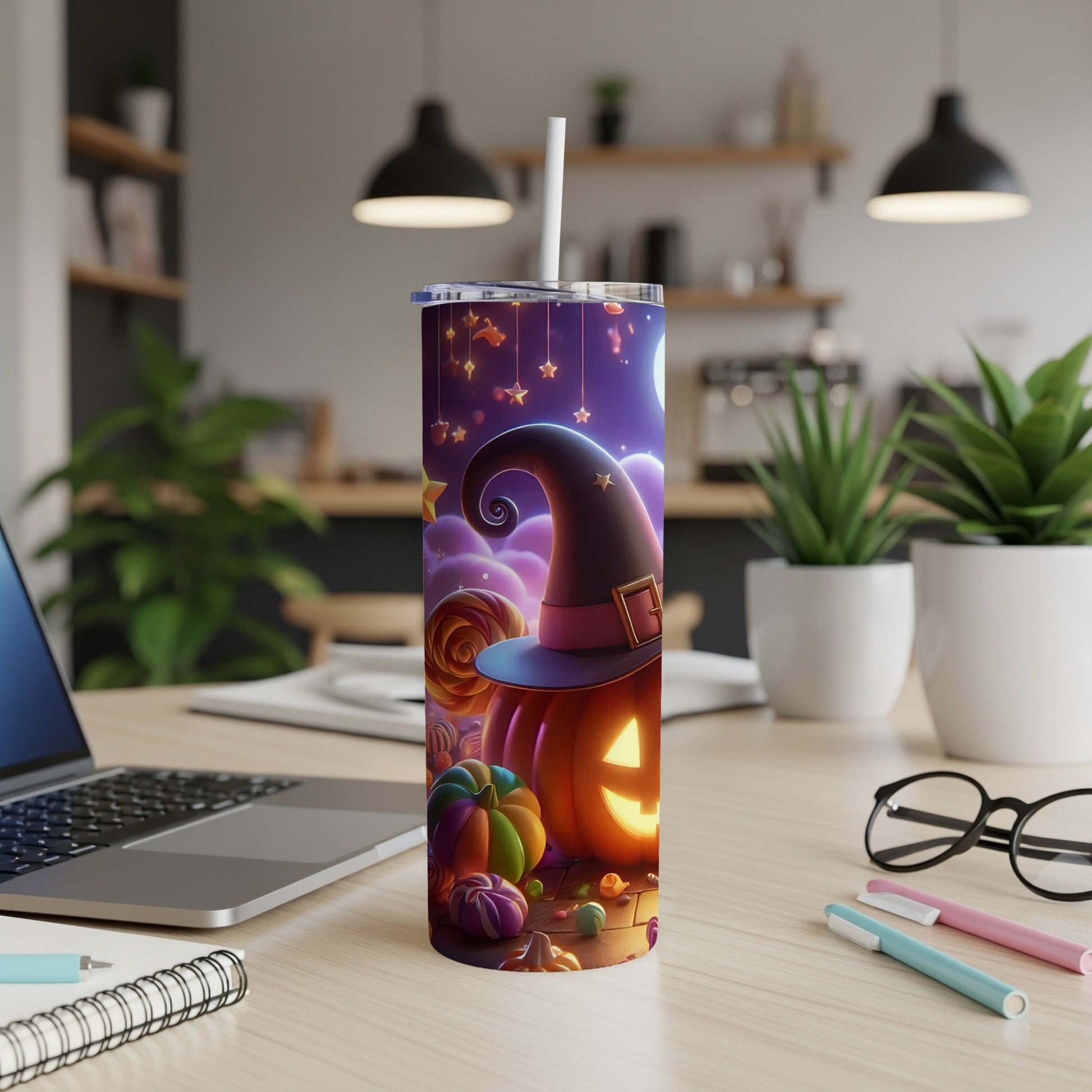 Halloween tumbler with pumpkins, candy, and witch hat design.