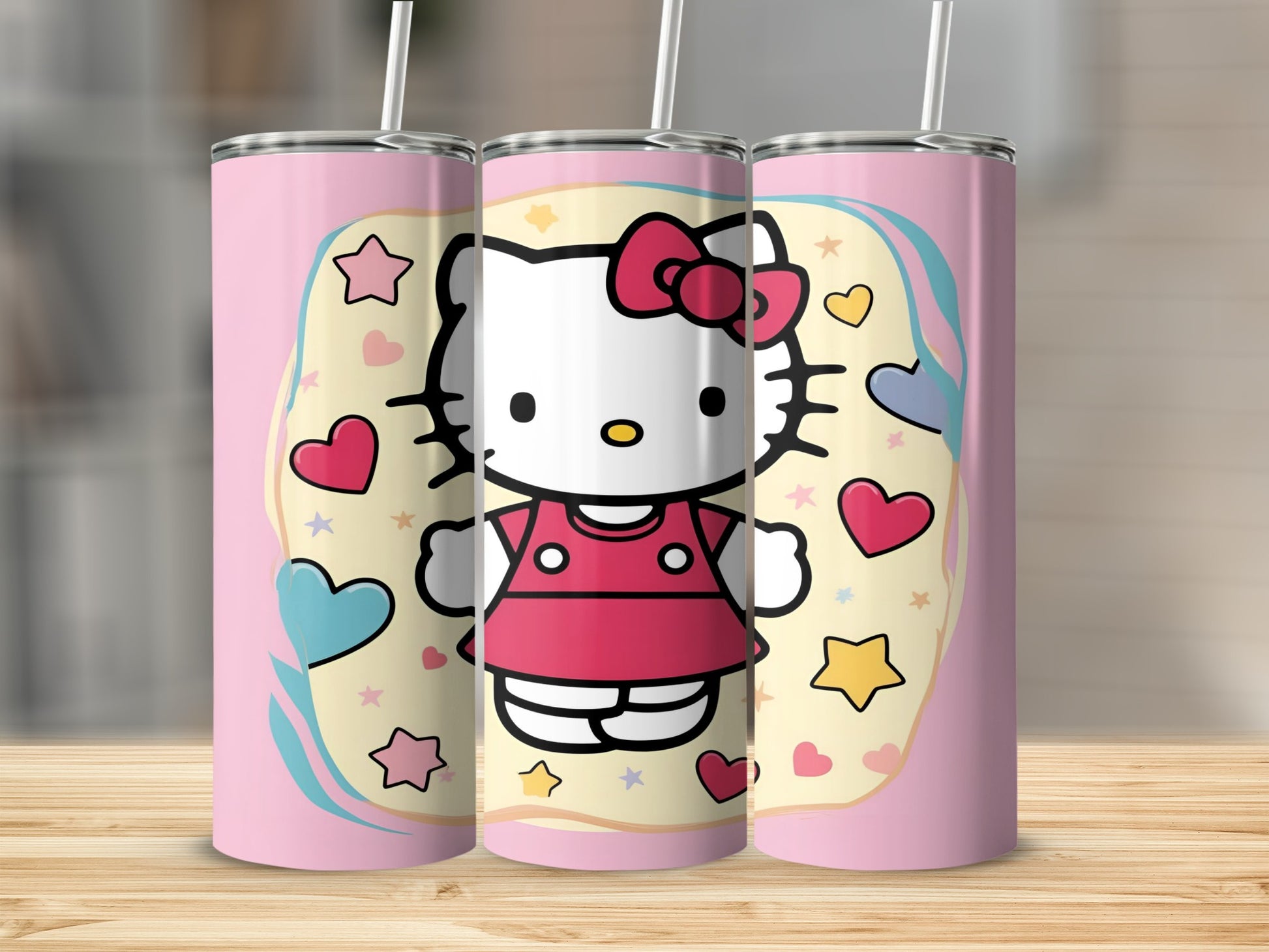 Three Hello Kitty tumblers with pink and pastel heart and star designs.