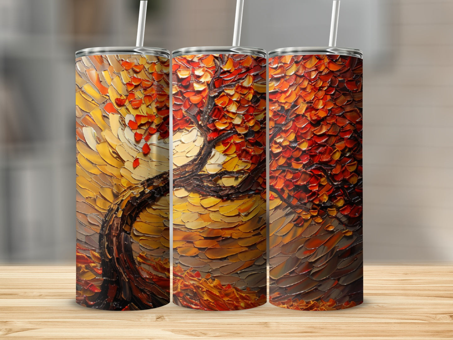 Three tumblers with textured autumn tree artwork, featuring vibrant orange and red leaves.