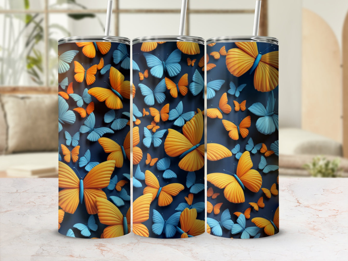 Three tumblers decorated with a repeating pattern of orange and blue butterflies.