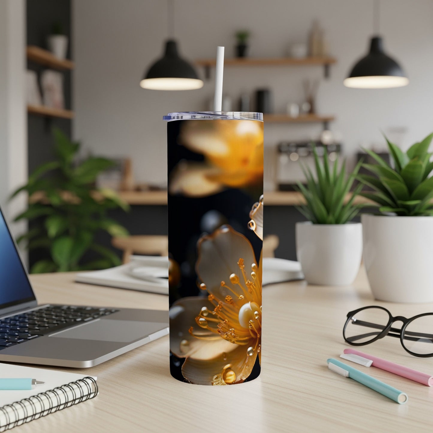Tall tumbler with yellow flower and water droplets against dark background.