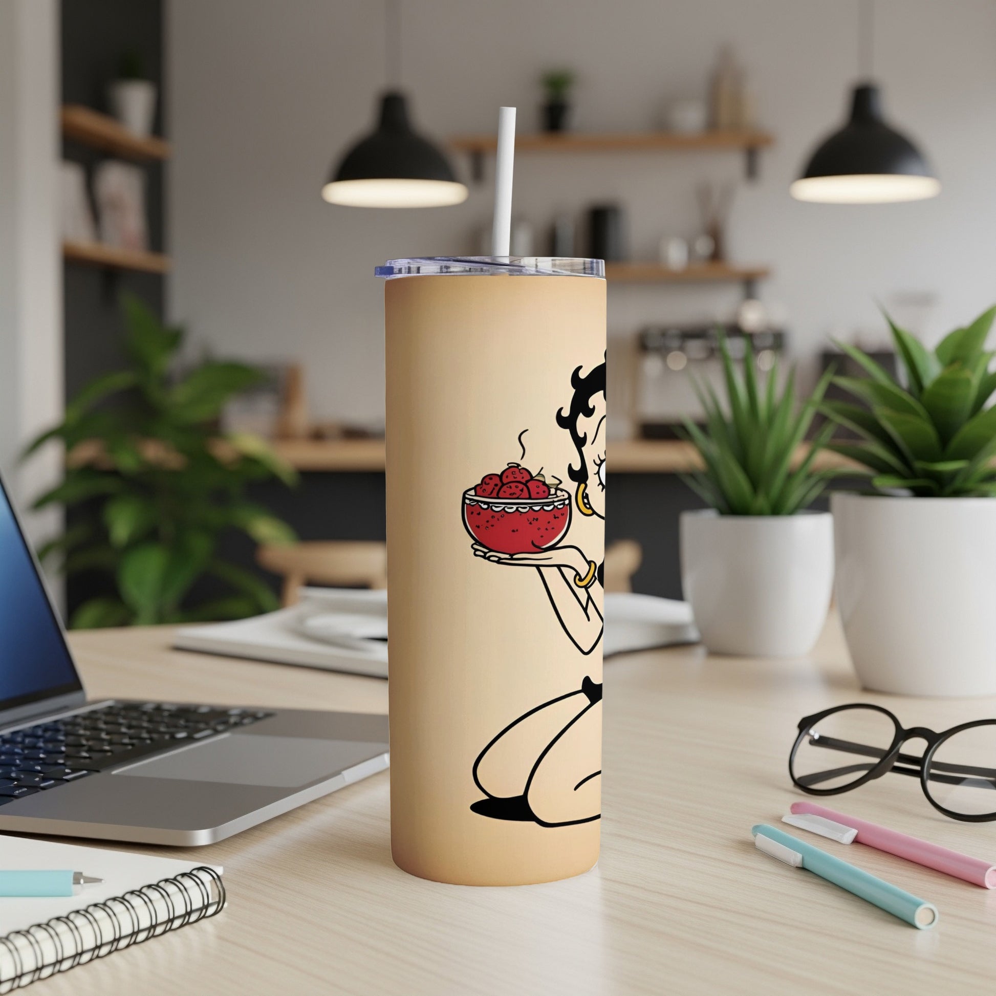 Betty Boop on a tan tumbler holding a bowl of hearts with a white straw.