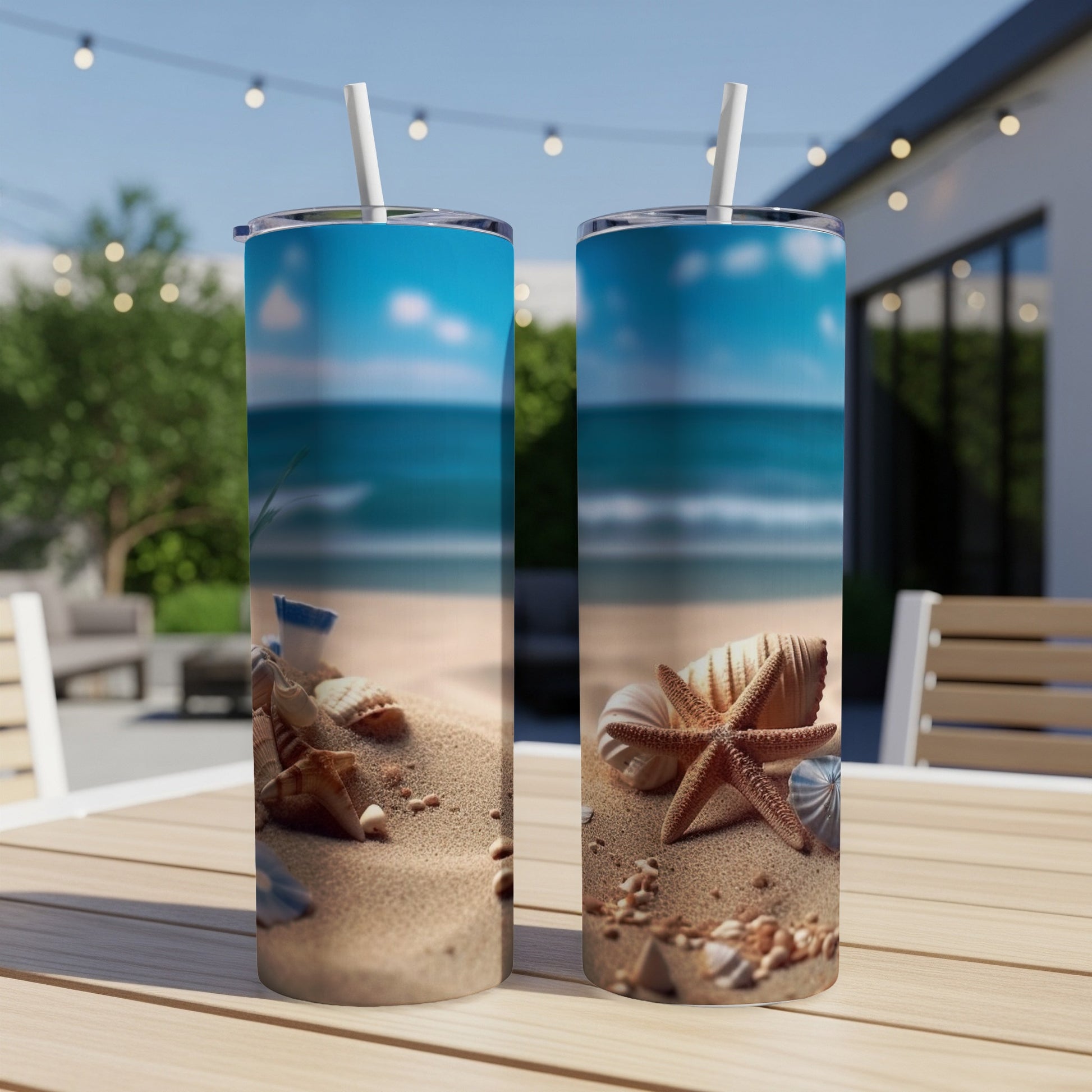 Two tumblers featuring a beach scene with sand, shells, and ocean.