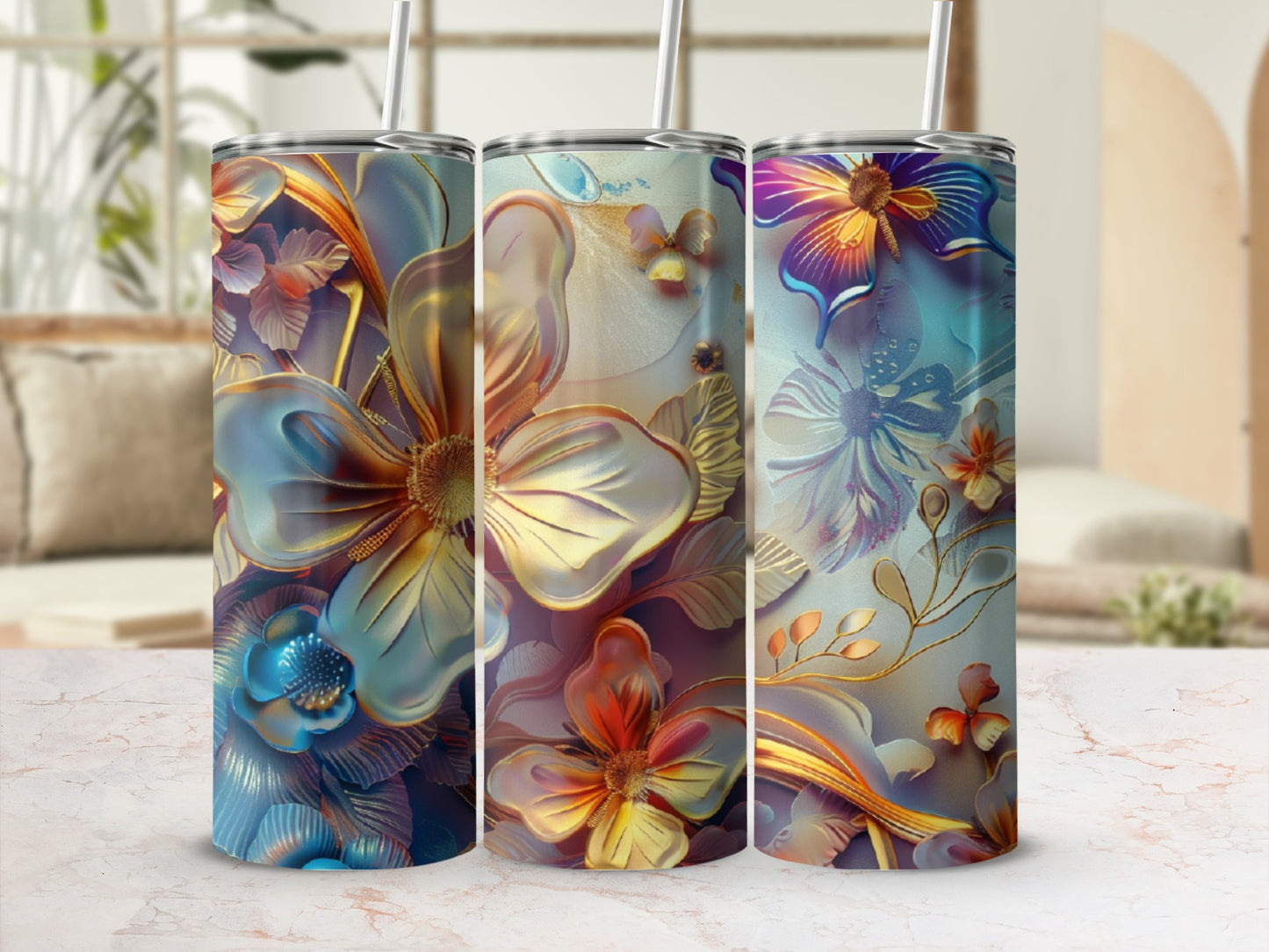 Three tumblers with floral designs in blue, gold, and purple tones.