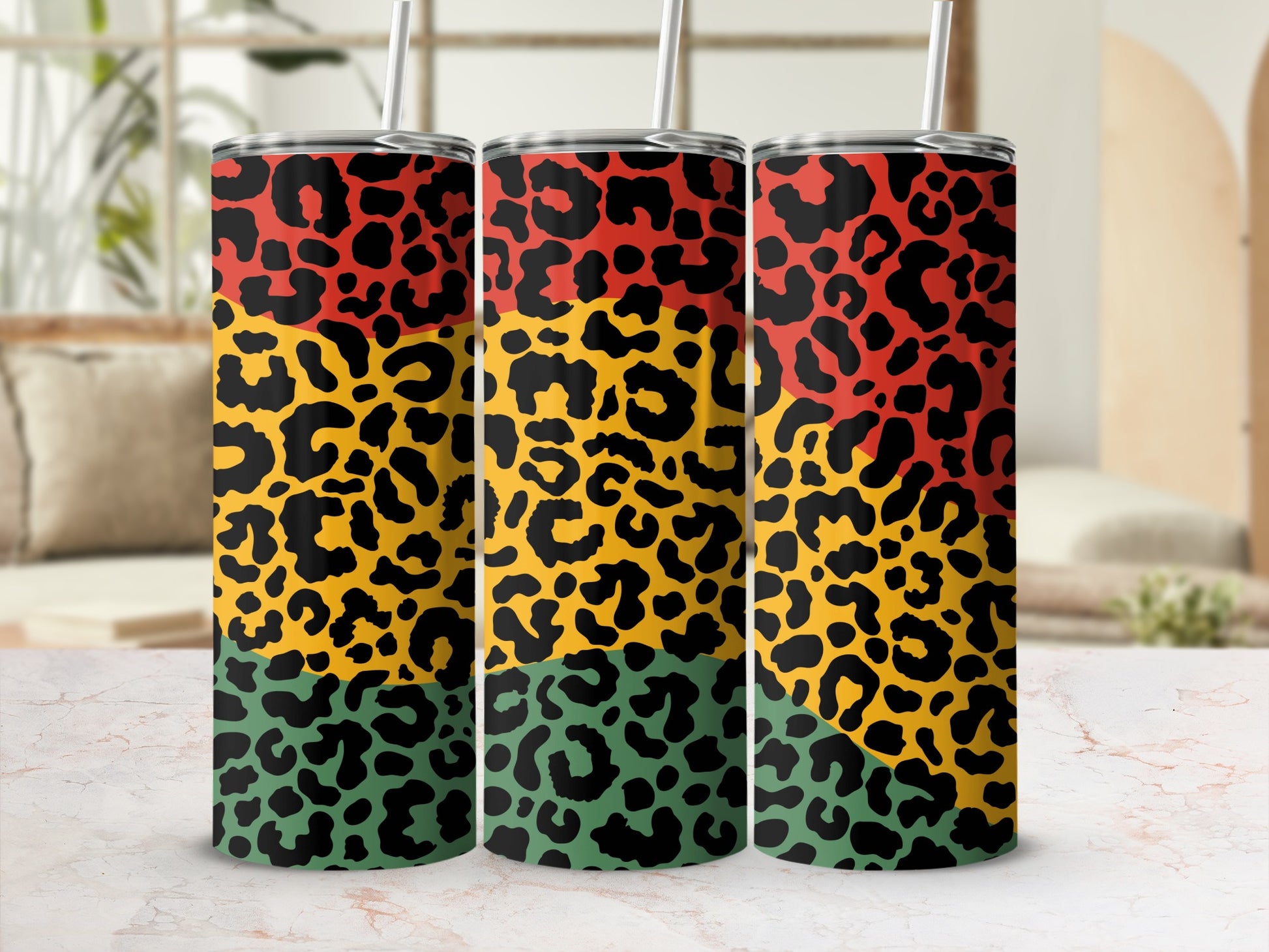 Three tumblers with leopard print in red, yellow, and green horizontal bands.