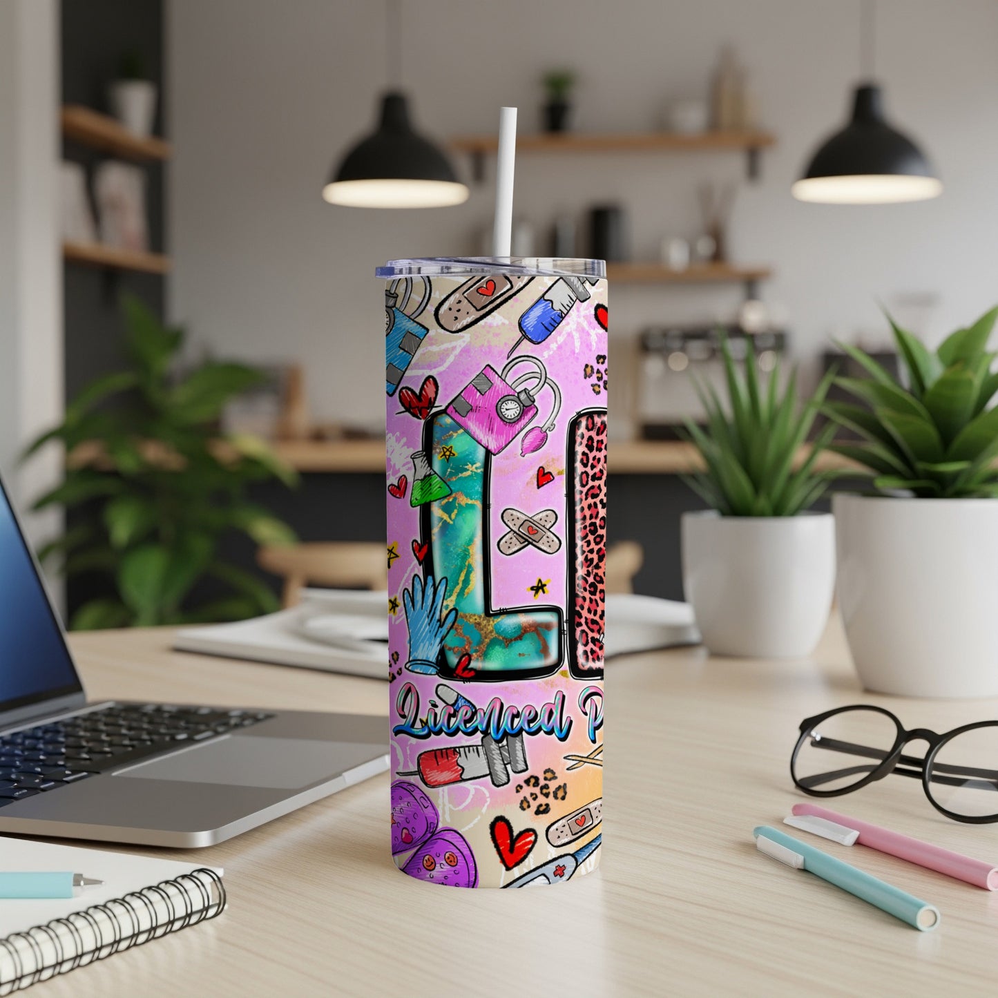 Pink tumbler with "Licensed Practical Nurse" text and medical-themed graphics.